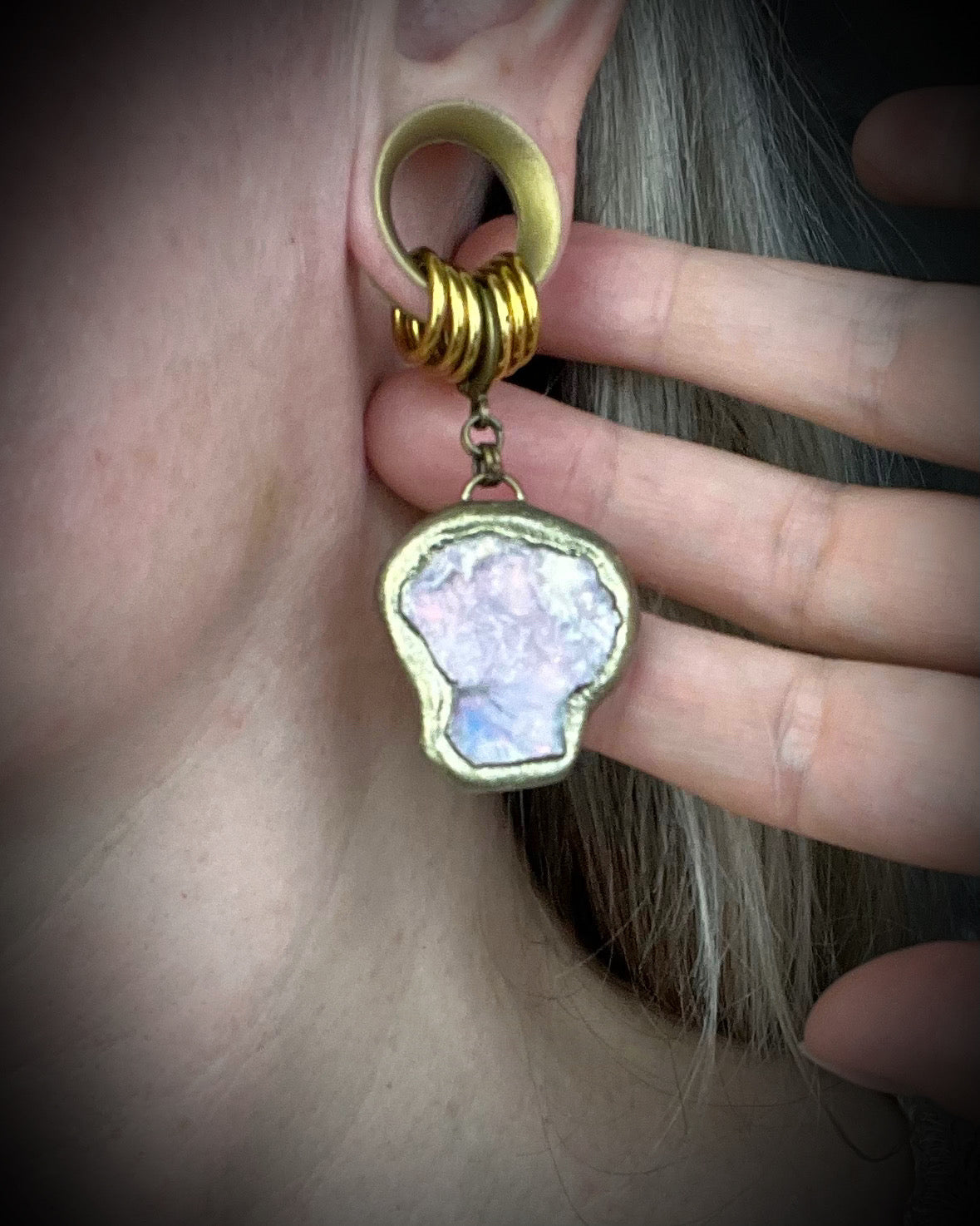Handmade lepidolite crystal earrings with soft purple gemstone stones on gold finish hypoallergenic brass huggie hooks, created by Baltimore crystal jewelry artist Become Spellbound.