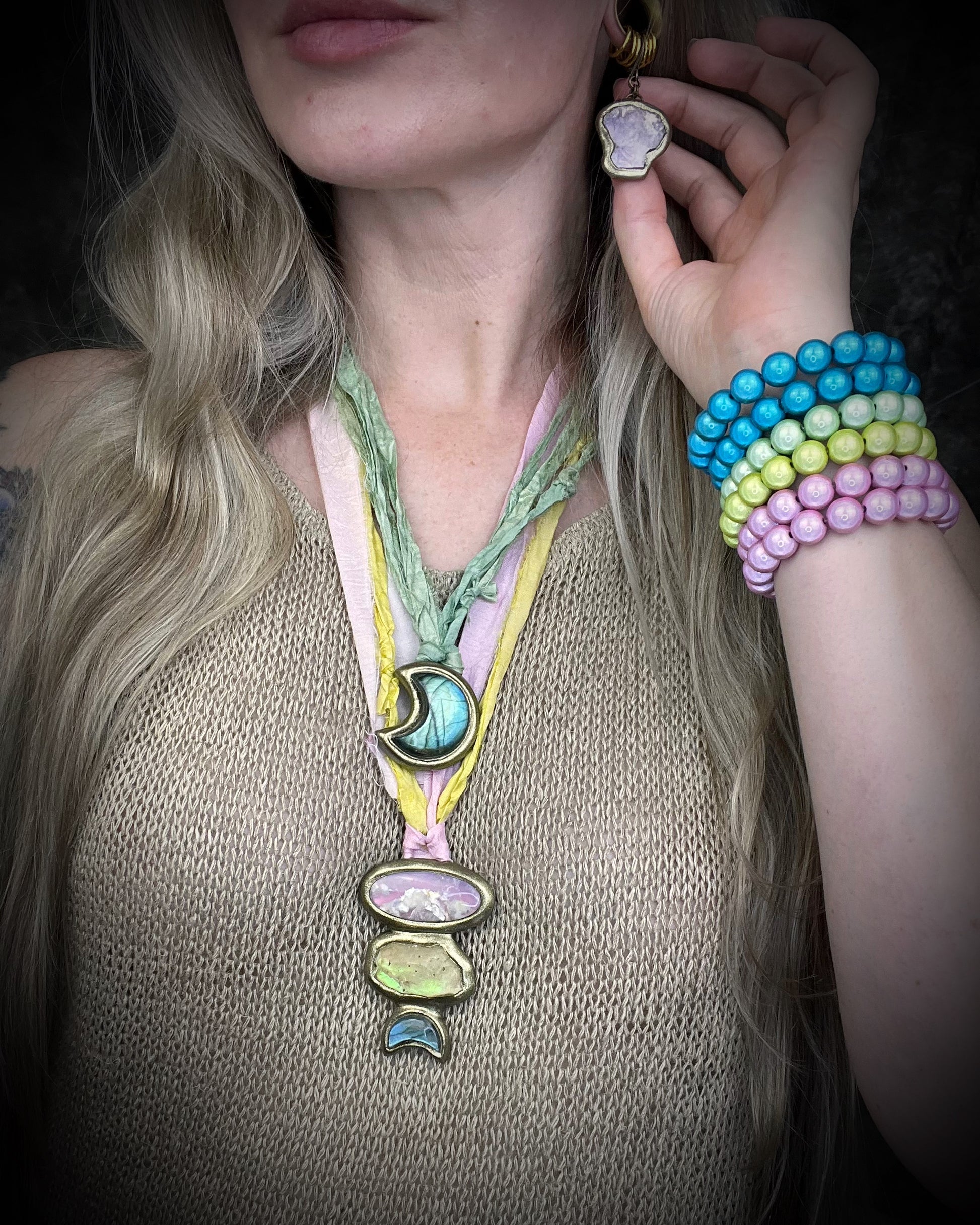 Handmade lepidolite crystal earrings with soft purple gemstone stones on gold finish hypoallergenic brass huggie hooks, created by Baltimore crystal jewelry artist Become Spellbound.