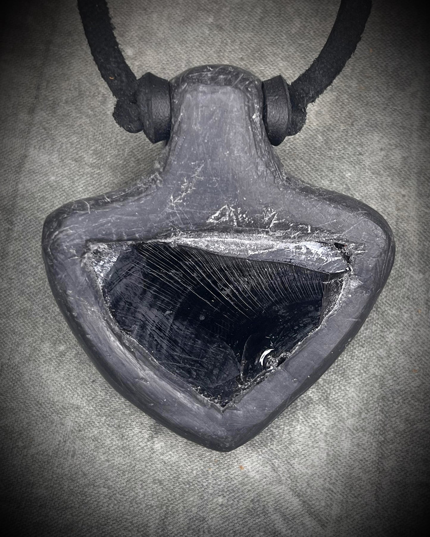 Handmade obsidian pendant with citrine crystal on black leather featuring a handmade wire clasp, rugged artisan gemstone necklace by Anothai Hansen.