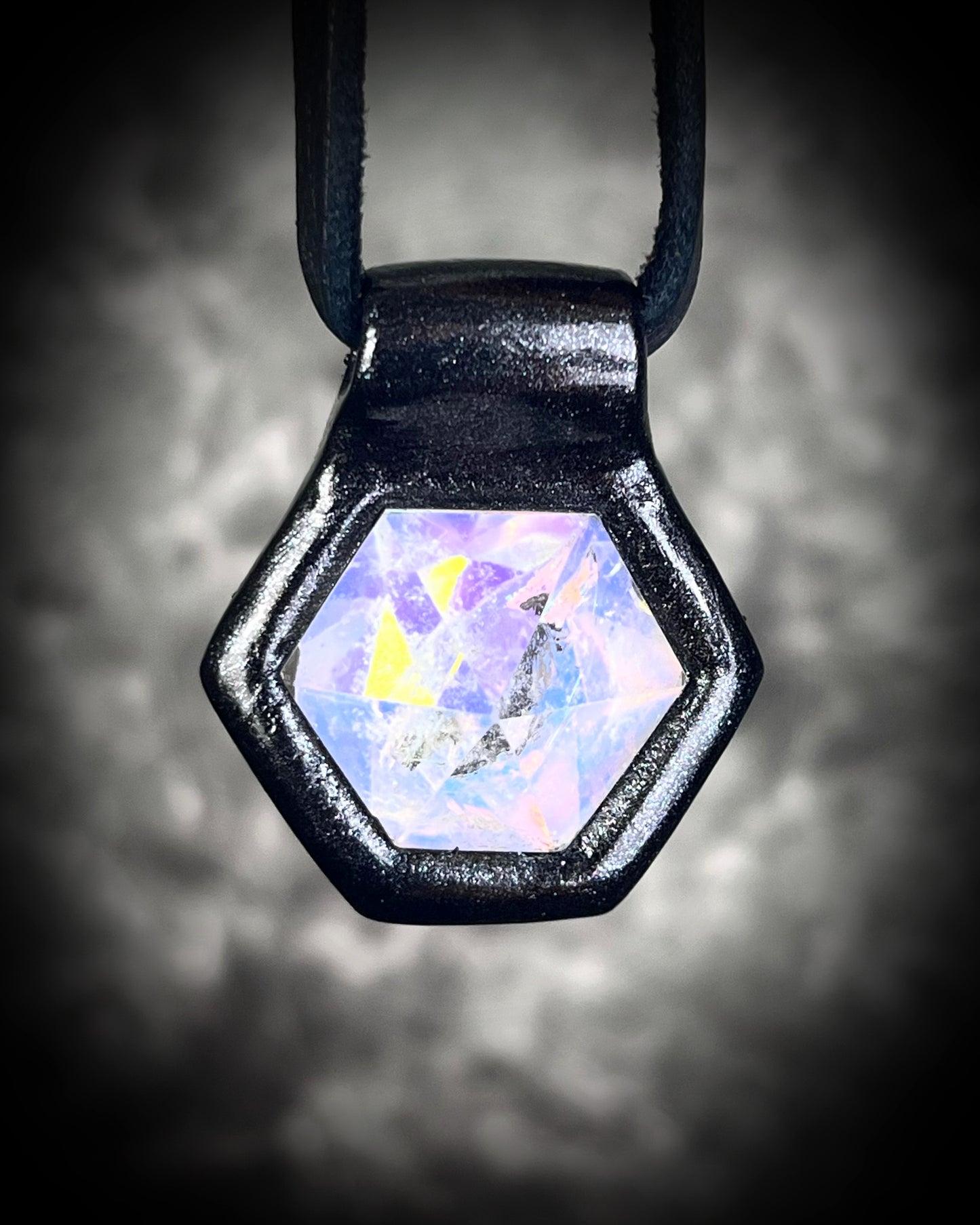 Handmade opalescent quartz talisman necklace on black leather, gothic crystal pendant with shimmering opal hues, mystical statement jewelry for fall fashion.