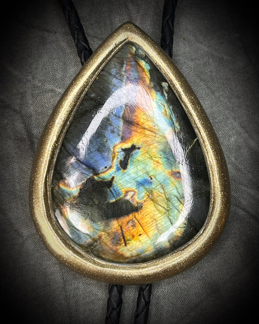 Handmade rainbow labradorite bolo tie in a gold finish on black braided leather. Witchy western gothic bolo tie gift for him or her. 