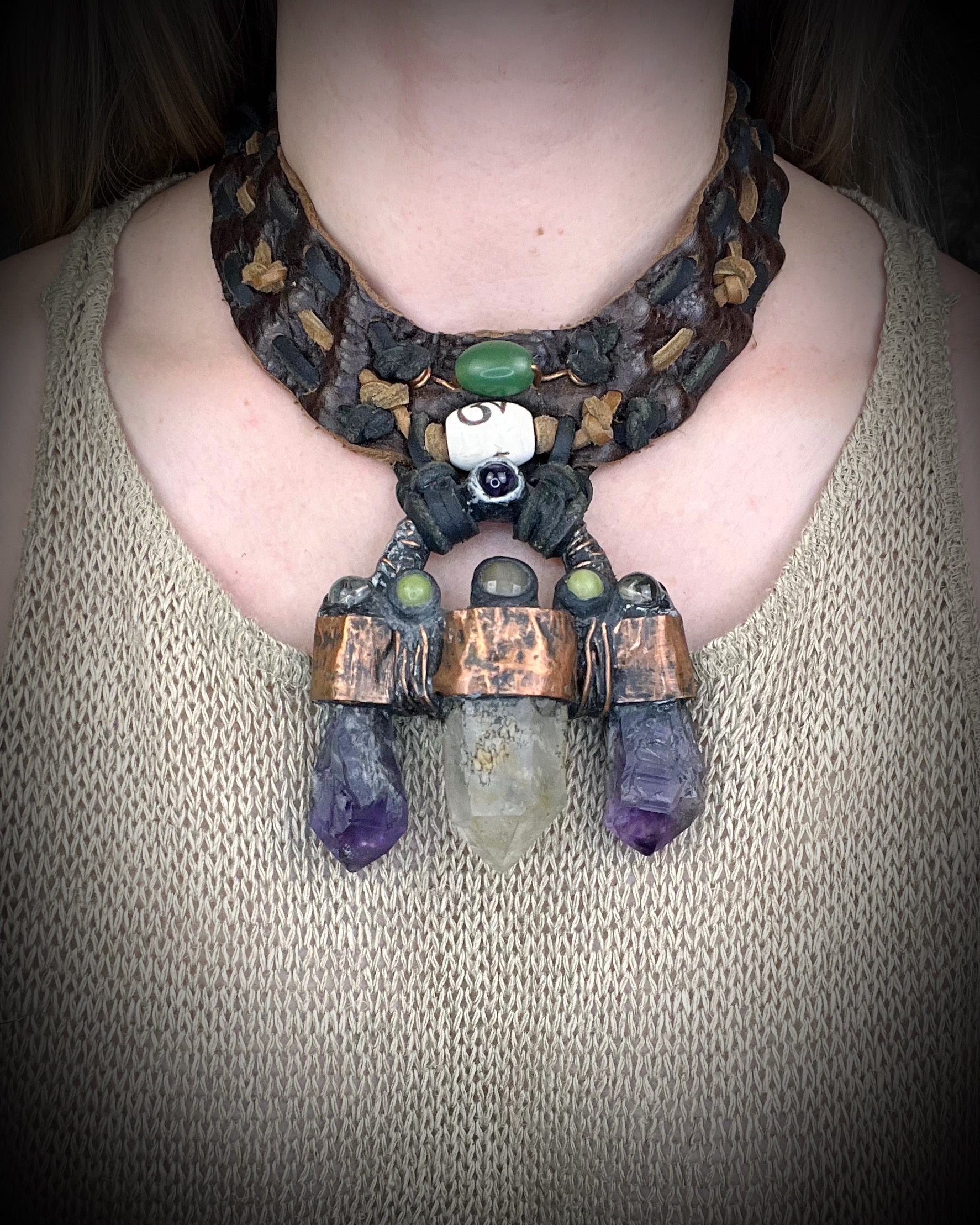 Handmade trident leather choker with quartz point, amethyst points, yellow jade, brass details, and copper wire clasp by Anothai Hansen.