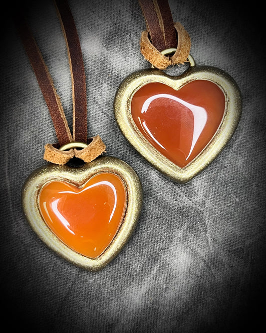 Heart-shaped carnelian crystal pendant with red hearts in a gold finish on brown leather. Holiday gift for her!