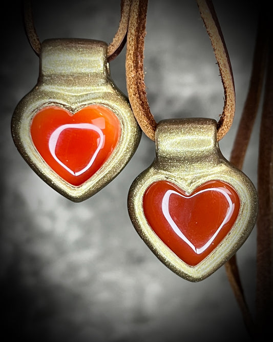 Heart-shaped pendants with red hearts in a gold finish on brown leather. Holiday gift for her!
