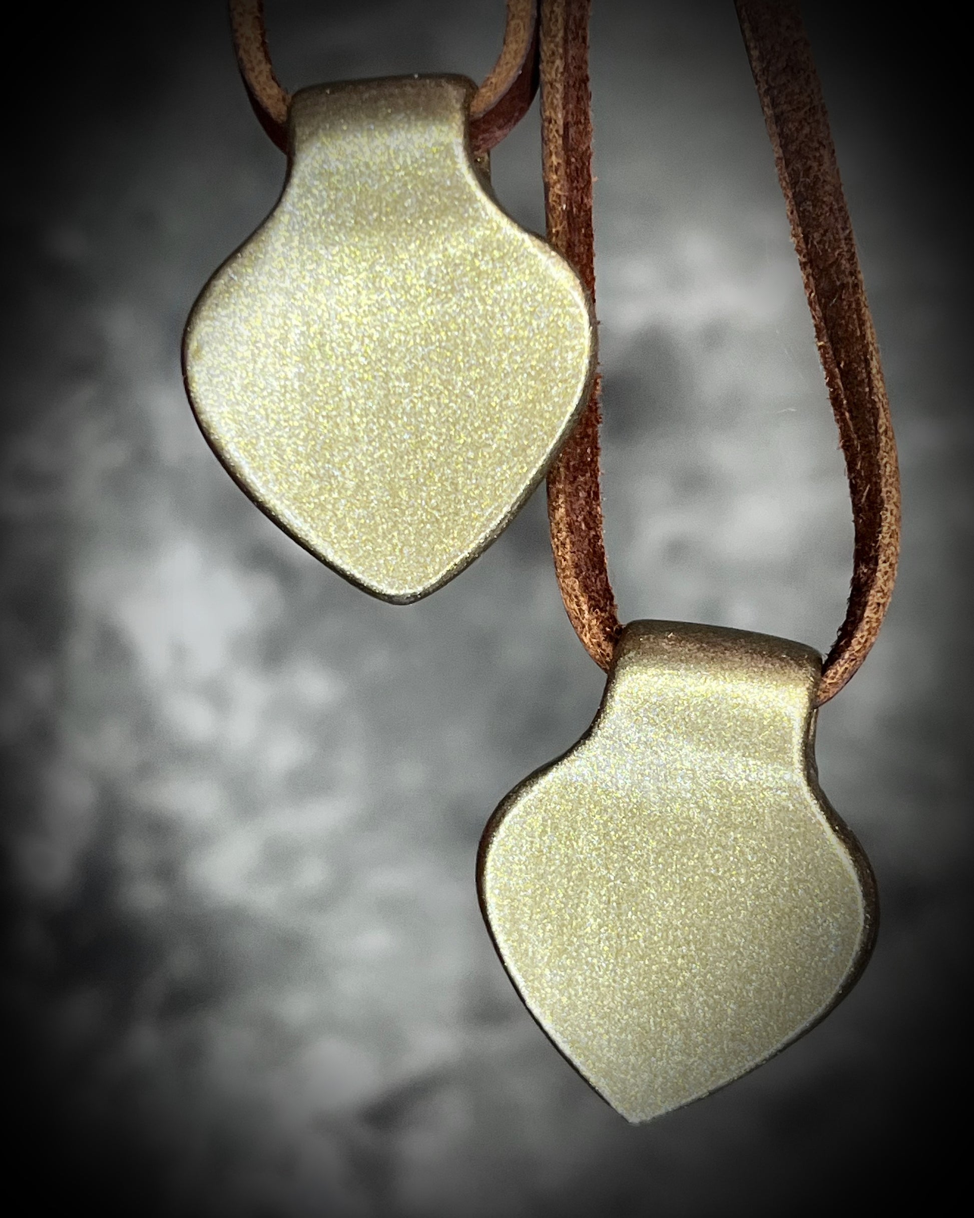 Heart-shaped pendants with red hearts in a gold finish on brown leather. Holiday gift for her!