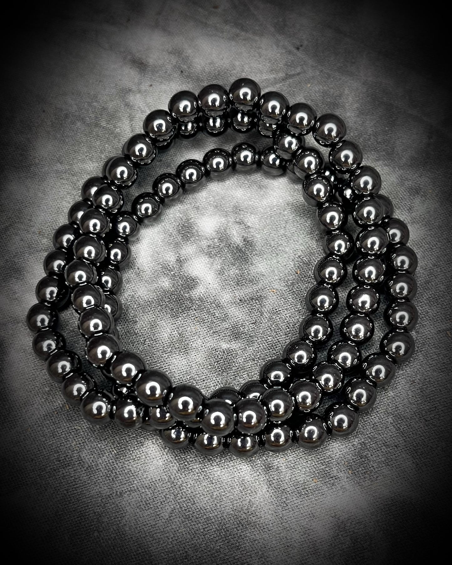 Hematite natural crystal healing beaded bracelets for protection, grounding, emf shielding and gemstone magic!  Crystal stacking bracelets for holiday gifting and new year resolution setting.