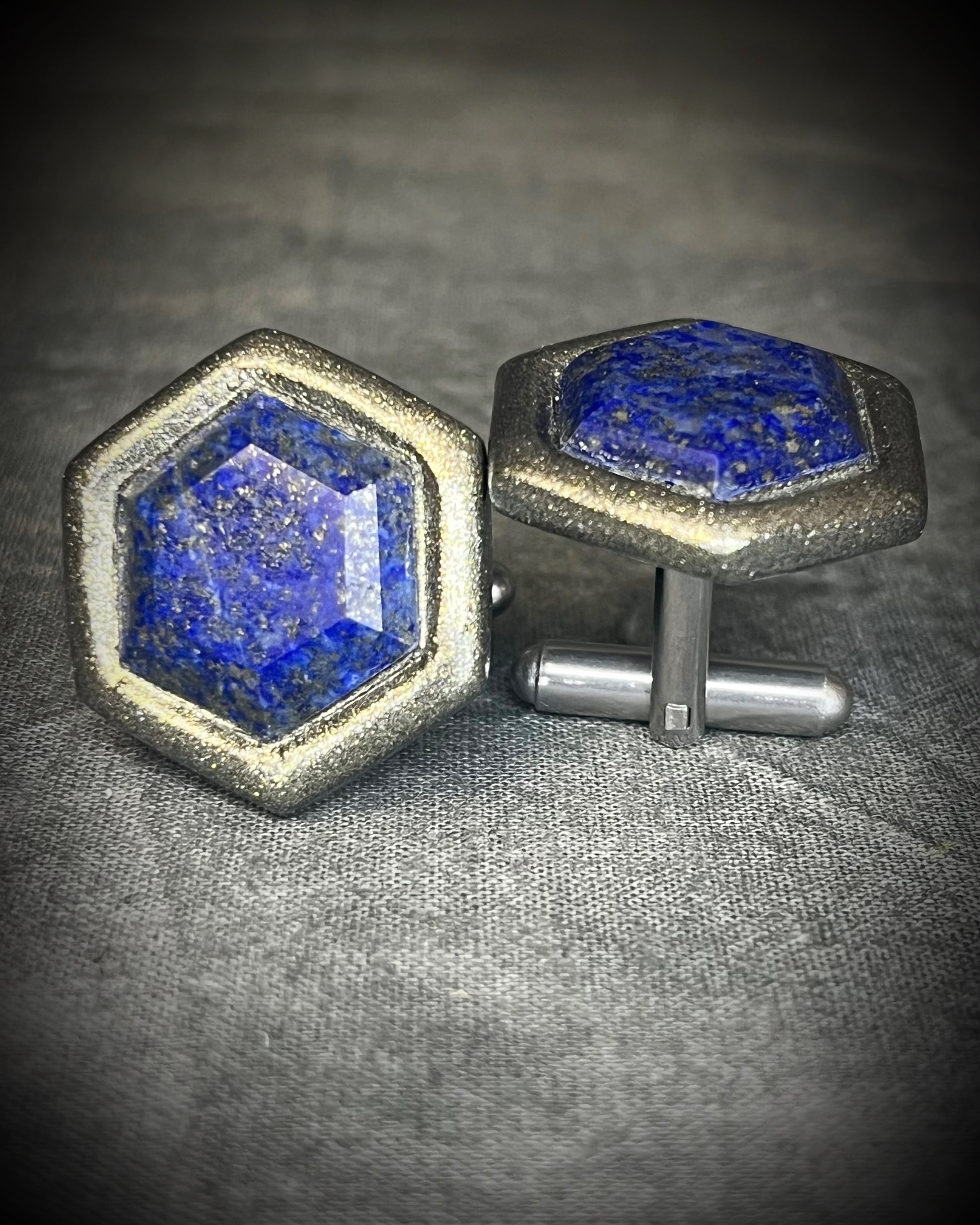 Hexagon-shaped lapis lazuli cufflinks with deep blue natural stone and stainless steel findings, handmade by Become Spellbound.