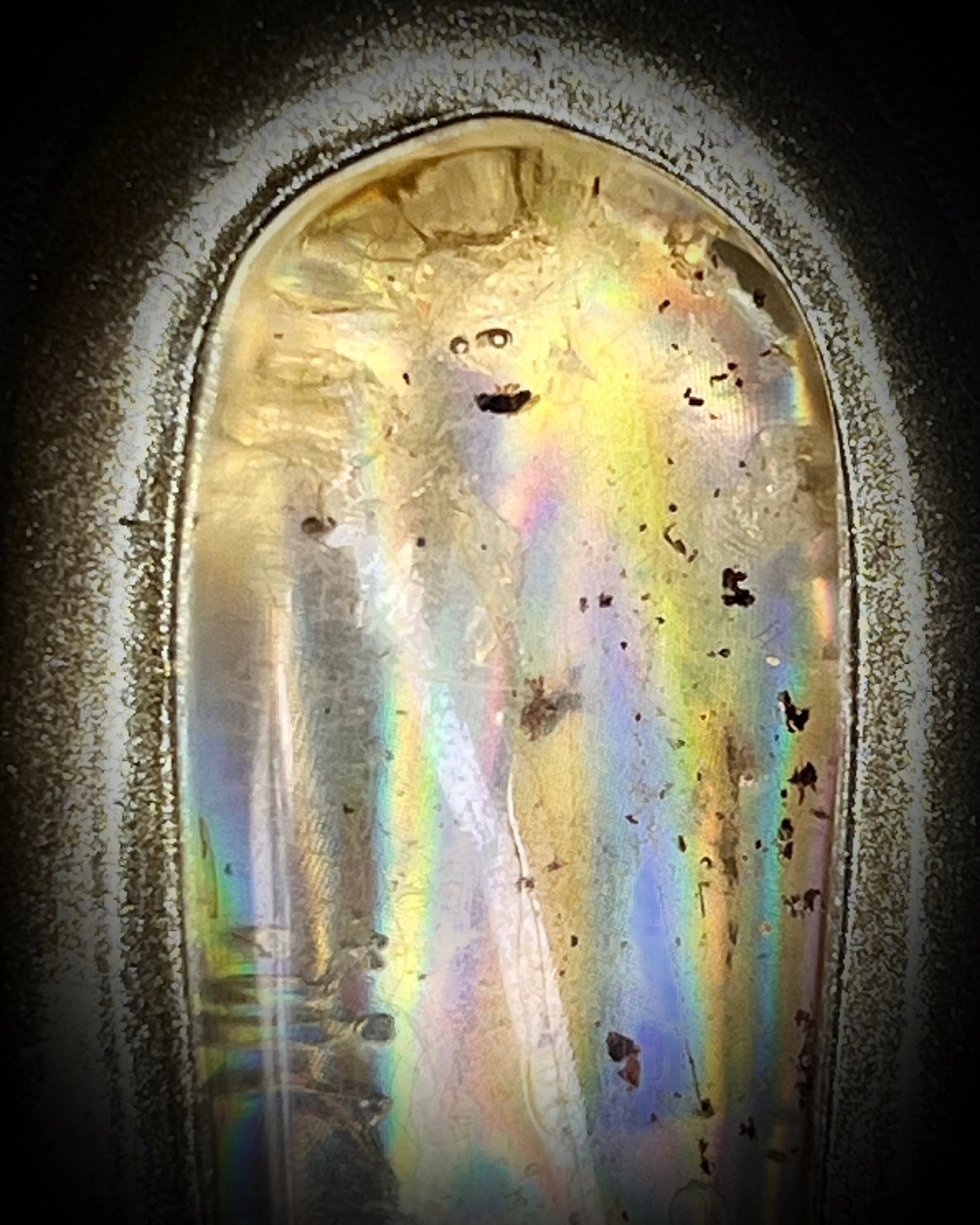  Close up of Insect included statement amber pendant in gold finish on marigold and yellow recycled silks. Enchanting ancient holiday gift for her!