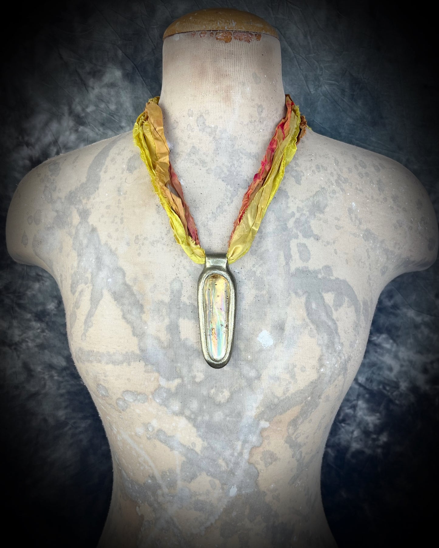  Insect included statement amber pendant in gold finish on marigold and yellow recycled silks worn on a bust. Enchanting ancient holiday gift for her!