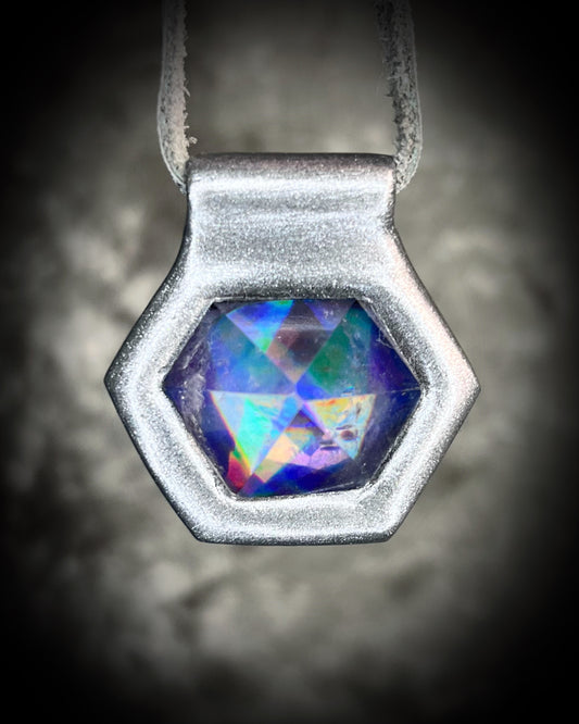 Iridescent aura black rainbow quartz crystal pendant in silver hanging from grey leather, chunky gemstone jewelry gift for her. David Bowie inspired jewelry.  