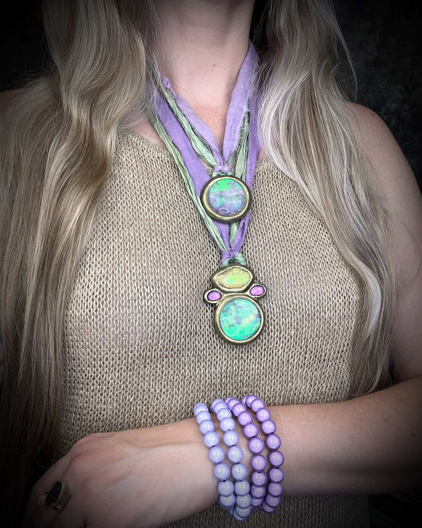 Libyan Desert Glass talisman with quartz crystal doublet, pink zircon crystals, and lilac and sea green recycled silk ties, handmade by Become Spellbound, Baltimore Magazine Best of Baltimore 2026 Jewelry winner.