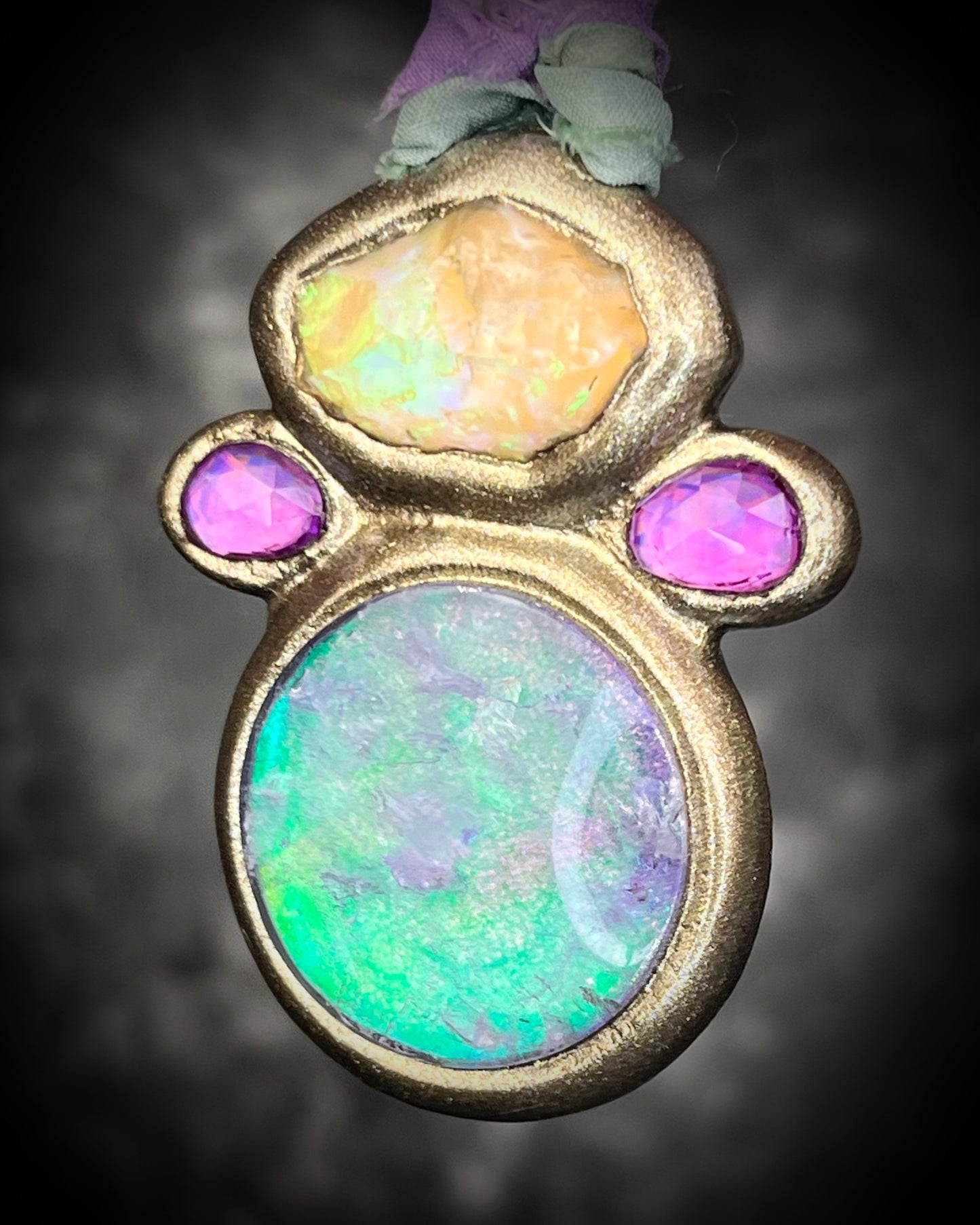 Libyan Desert Glass talisman with quartz crystal doublet, pink zircon crystals, and lilac and sea green recycled silk ties, handmade by Become Spellbound, Baltimore Magazine Best of Baltimore 2026 Jewelry winner.