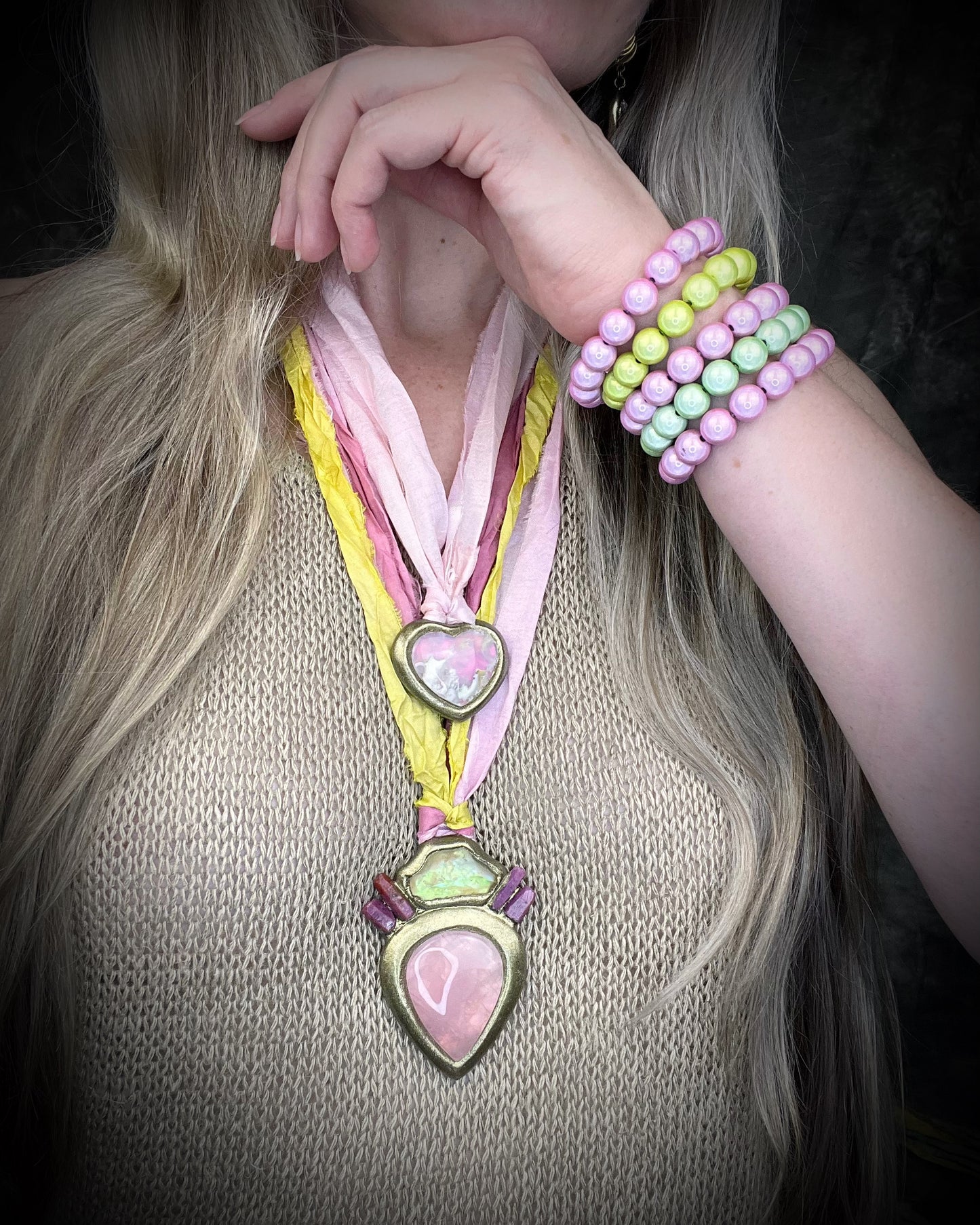 Libyan Desert Glass talisman with raw ruby crystals, rose quartz, and pink and yellow recycled silk ties by Become Spellbound, Baltimore Magazine Best of Baltimore 2026 Jewelry winner.