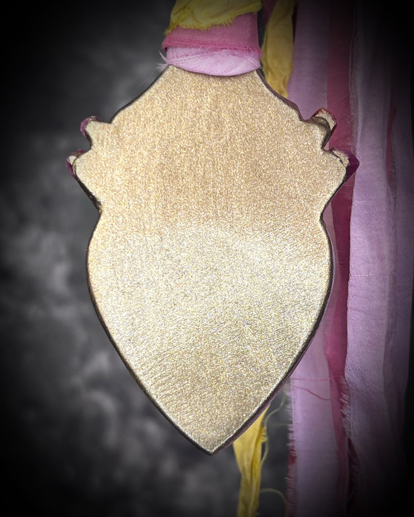 Libyan Desert Glass talisman with raw ruby crystals, rose quartz, and pink and yellow recycled silk ties by Become Spellbound, Baltimore Magazine Best of Baltimore 2026 Jewelry winner.