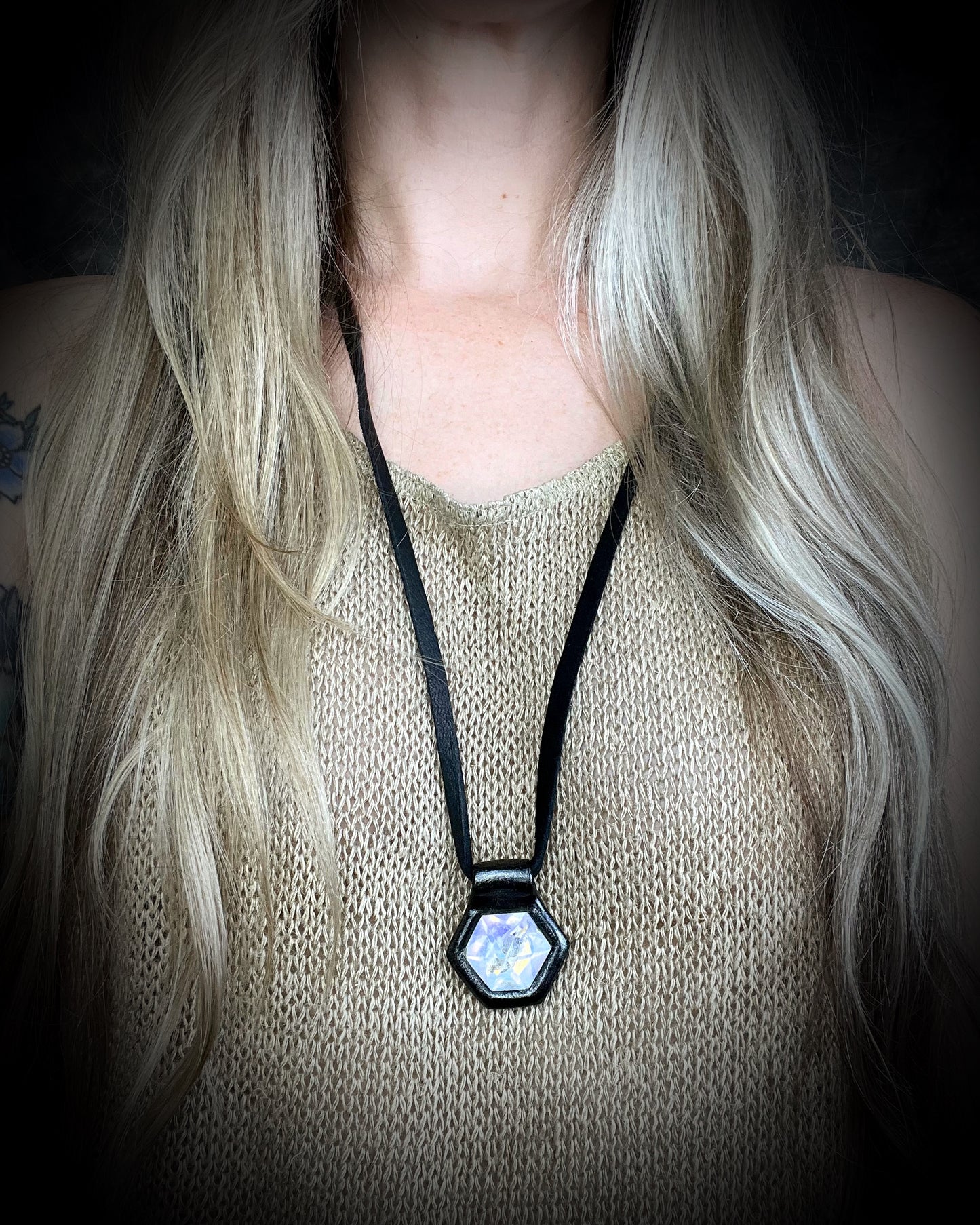 Magical opal-shimmer quartz pendant necklace on black leather, gothic statement jewelry for fall, witchy necklace for Halloween or spiritual styling.