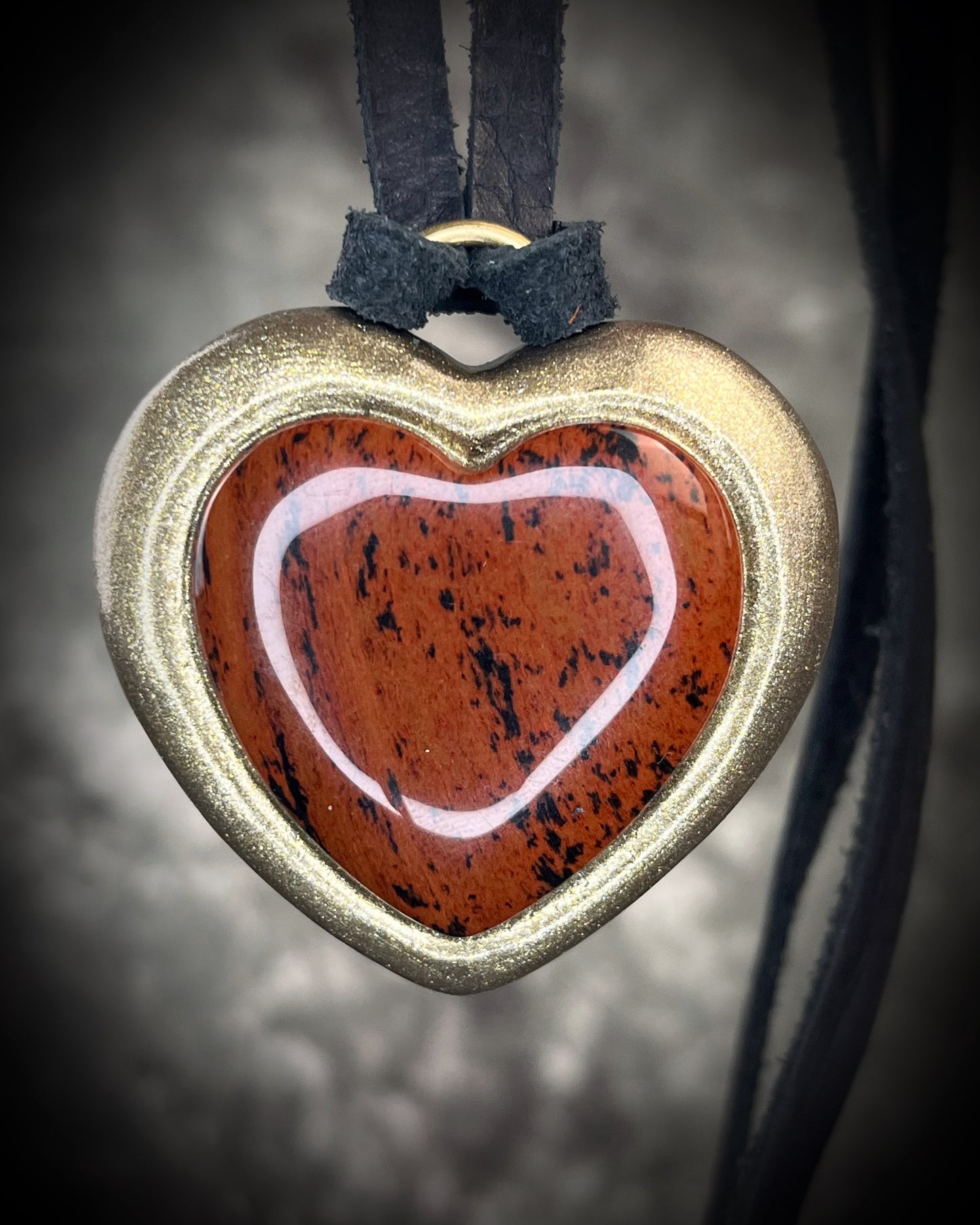 Mahogany obsidian heart pendant necklace in gold finish on black leather. Grounding protection crystal jewelry symbolizing strength and resilience. Gift for her.