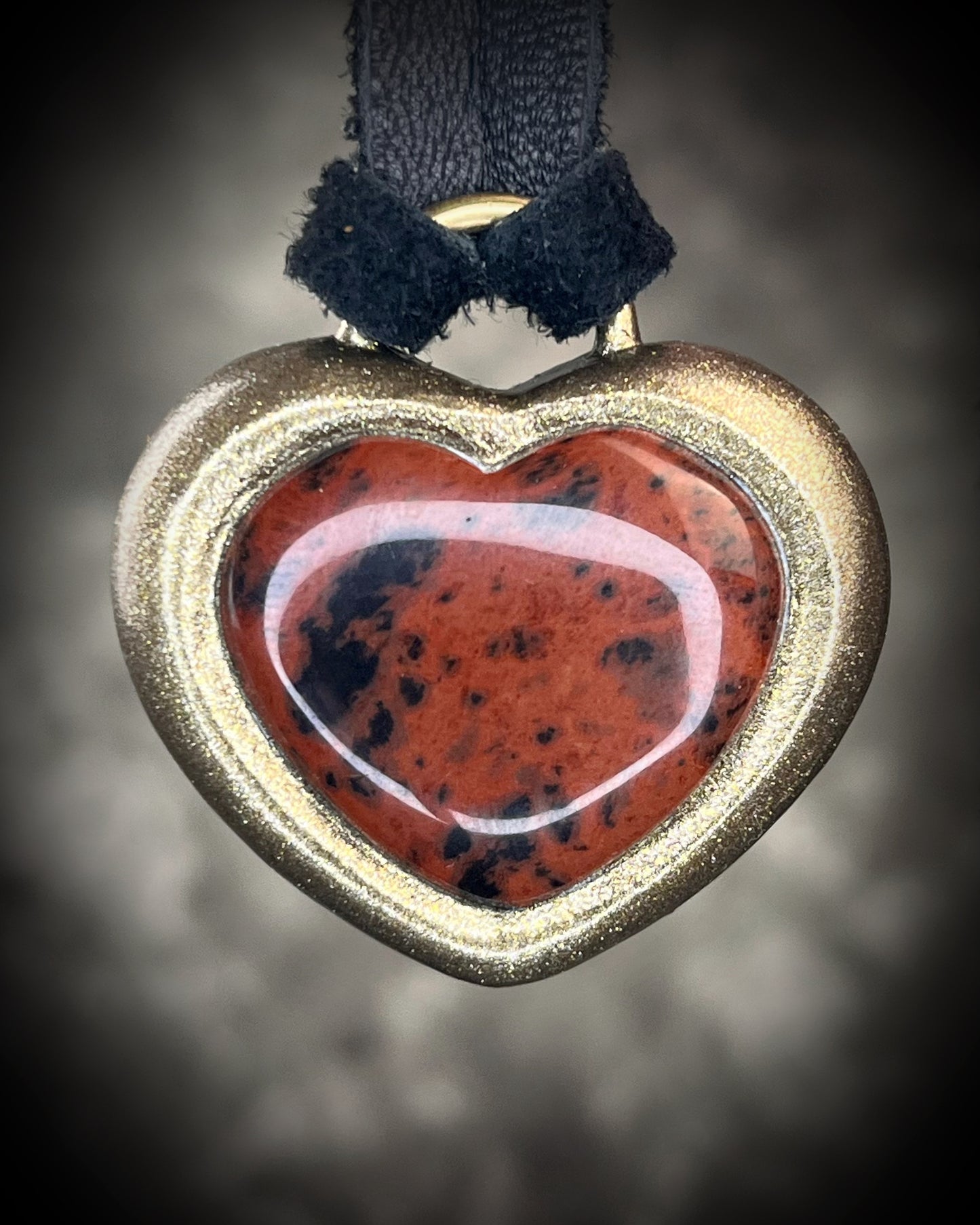 Mahogany obsidian heart pendant necklace in gold finish on black leather. Grounding protection crystal jewelry symbolizing strength and resilience. Gift for her.