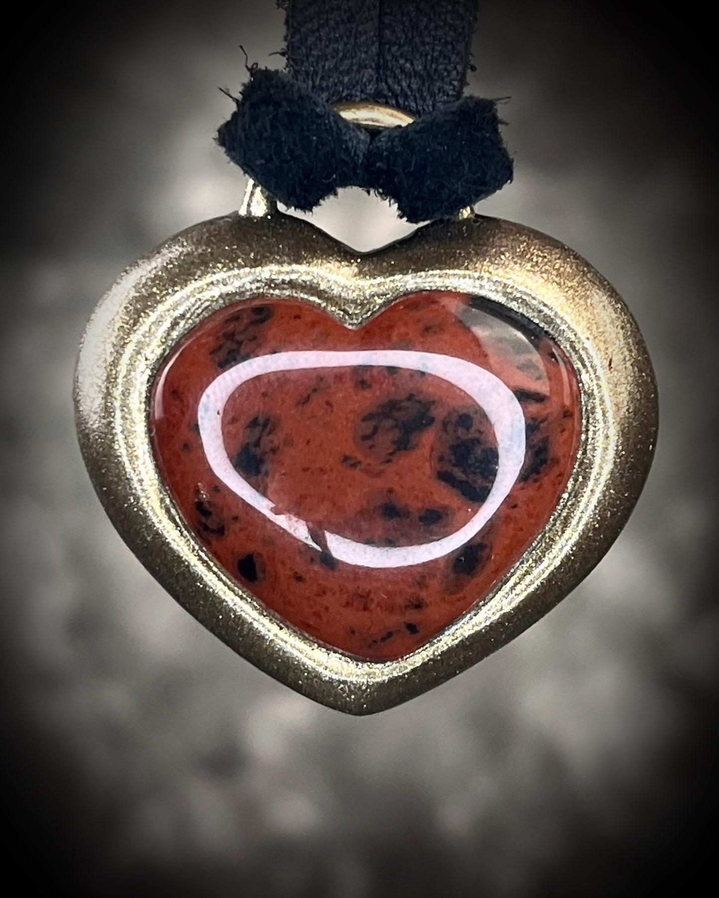 Mahogany obsidian heart pendant necklace in gold finish on black leather. Grounding protection crystal jewelry symbolizing strength and resilience. Gift for her.