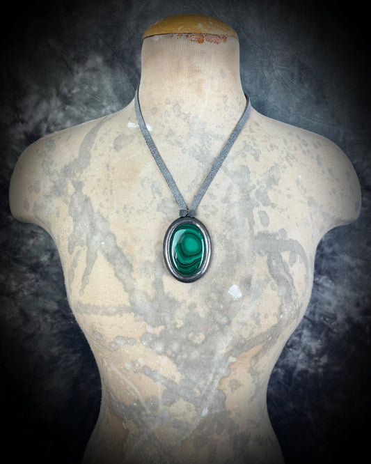 Malachite cabochon oval necklaces in gunmetal silvertone settings on grey leather – mystical crystal jewelry for heart chakra healing and protection. Handmade gemstone pendant talismans, grounding and protective malachite statement necklace-spiritual jewelry for daily wear, meditation, or gifting.