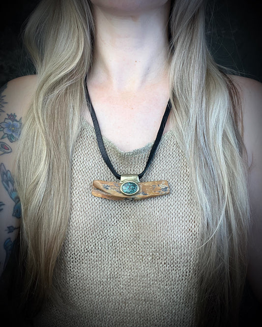 Mammoth tusk fossil and turquoise talisman on black leather, one-of-a-kind natural history jewelry handmade by Become Spellbound in Baltimore, Maryland.