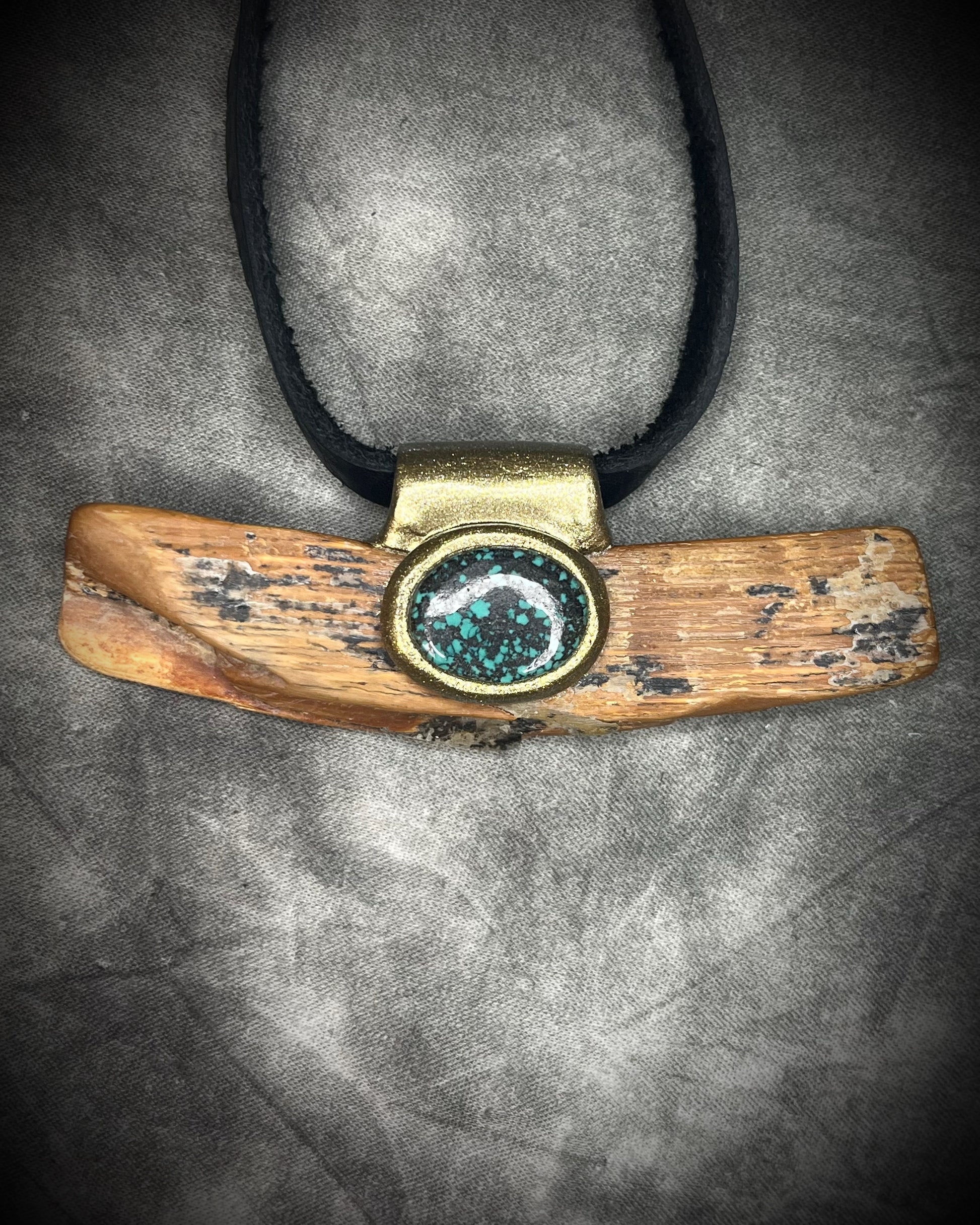 Mammoth tusk fossil and turquoise talisman on black leather, one-of-a-kind natural history jewelry handmade by Become Spellbound in Baltimore, Maryland.