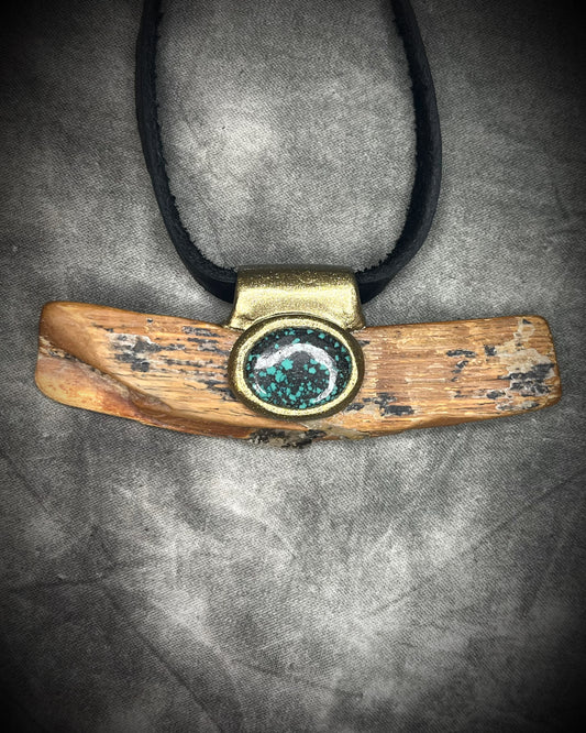Mammoth tusk fossil and turquoise talisman on black leather, one-of-a-kind natural history jewelry handmade by Become Spellbound in Baltimore, Maryland.