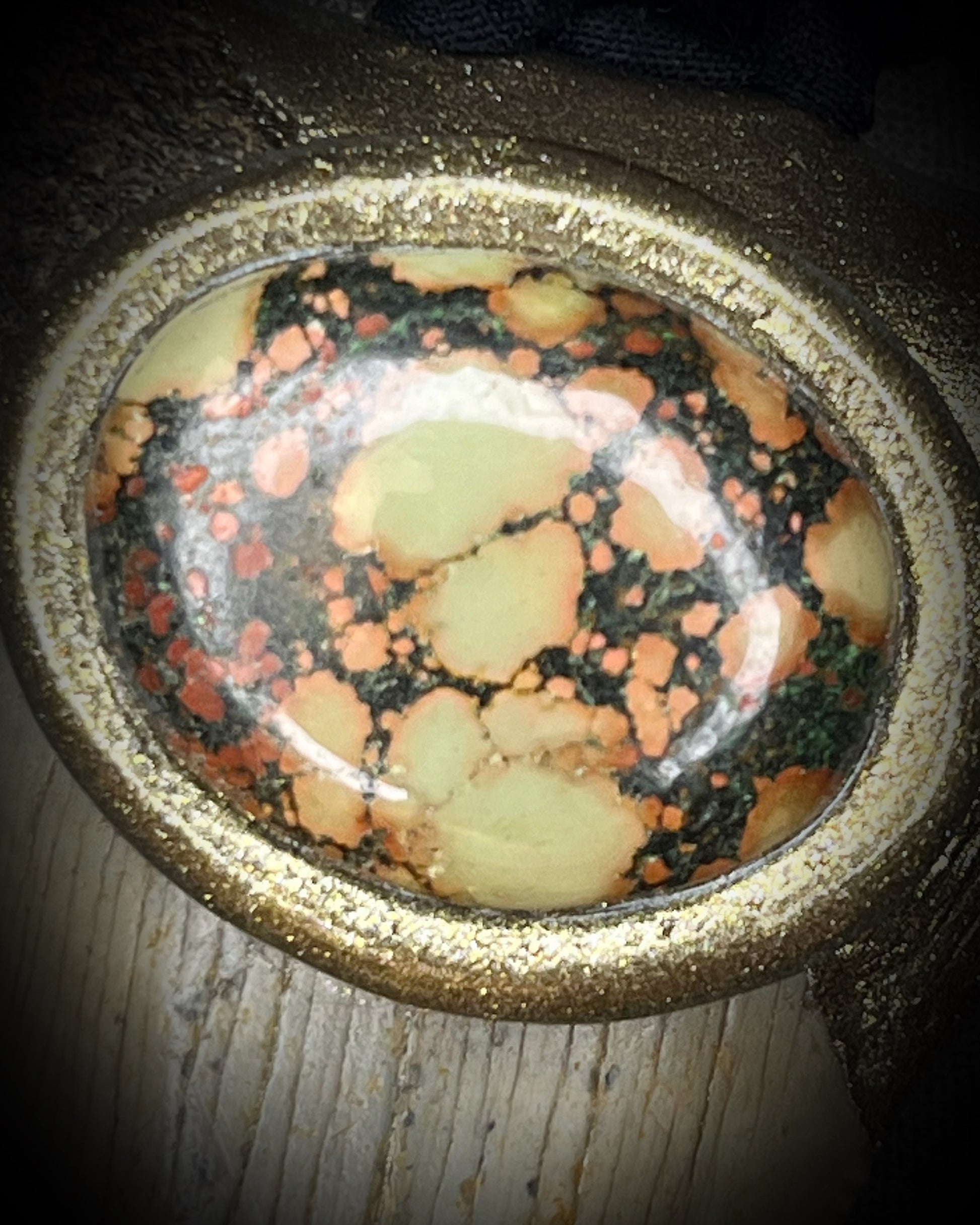 Megalodon fossil tooth talisman with earth-toned turquoise in moss green, orange and burgundy-red, gold finish, and black and brown recycled silk.