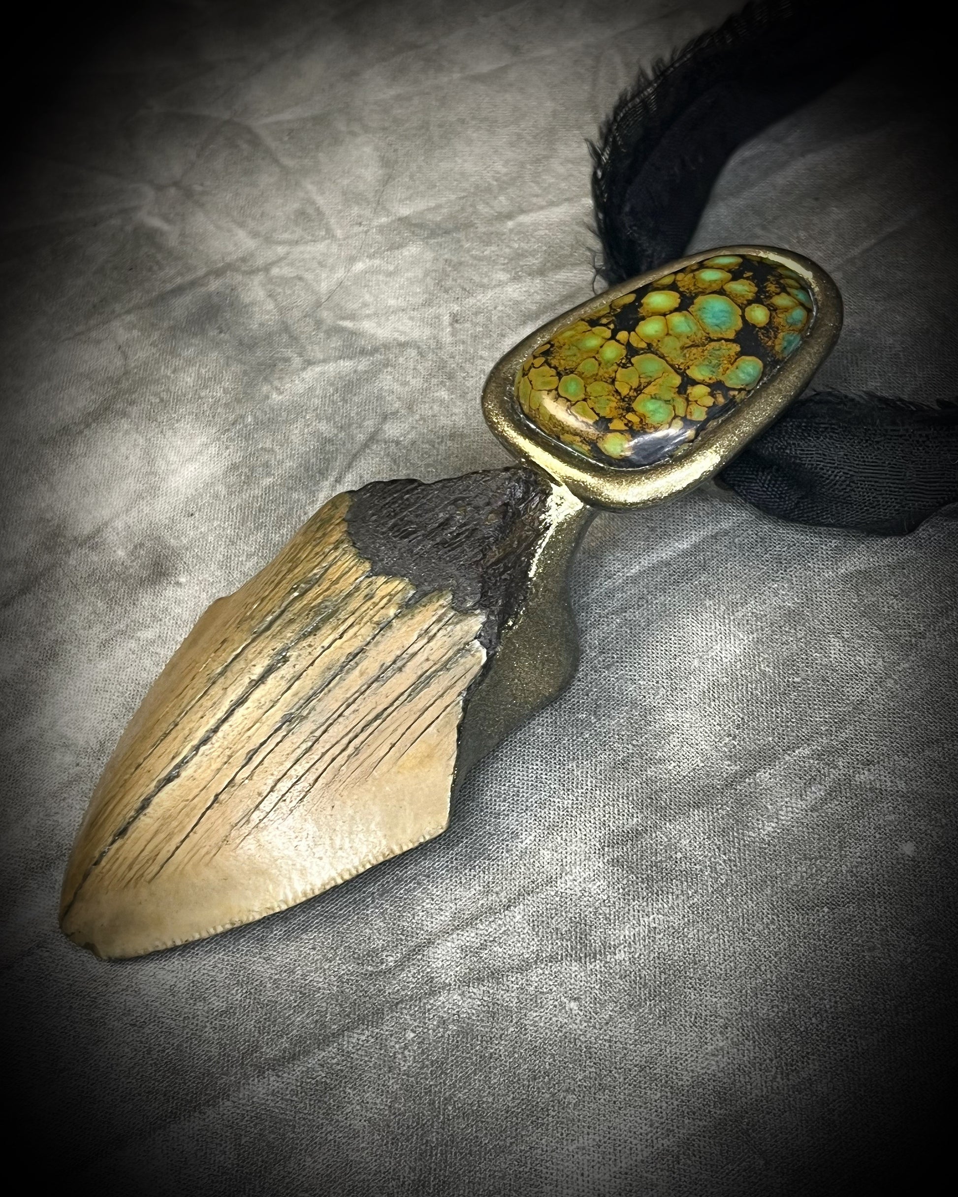 Megalodon fossil tooth talisman with sculptural turquoise in blue, moss green and mustard yellow, gold finish and black recycled silk.