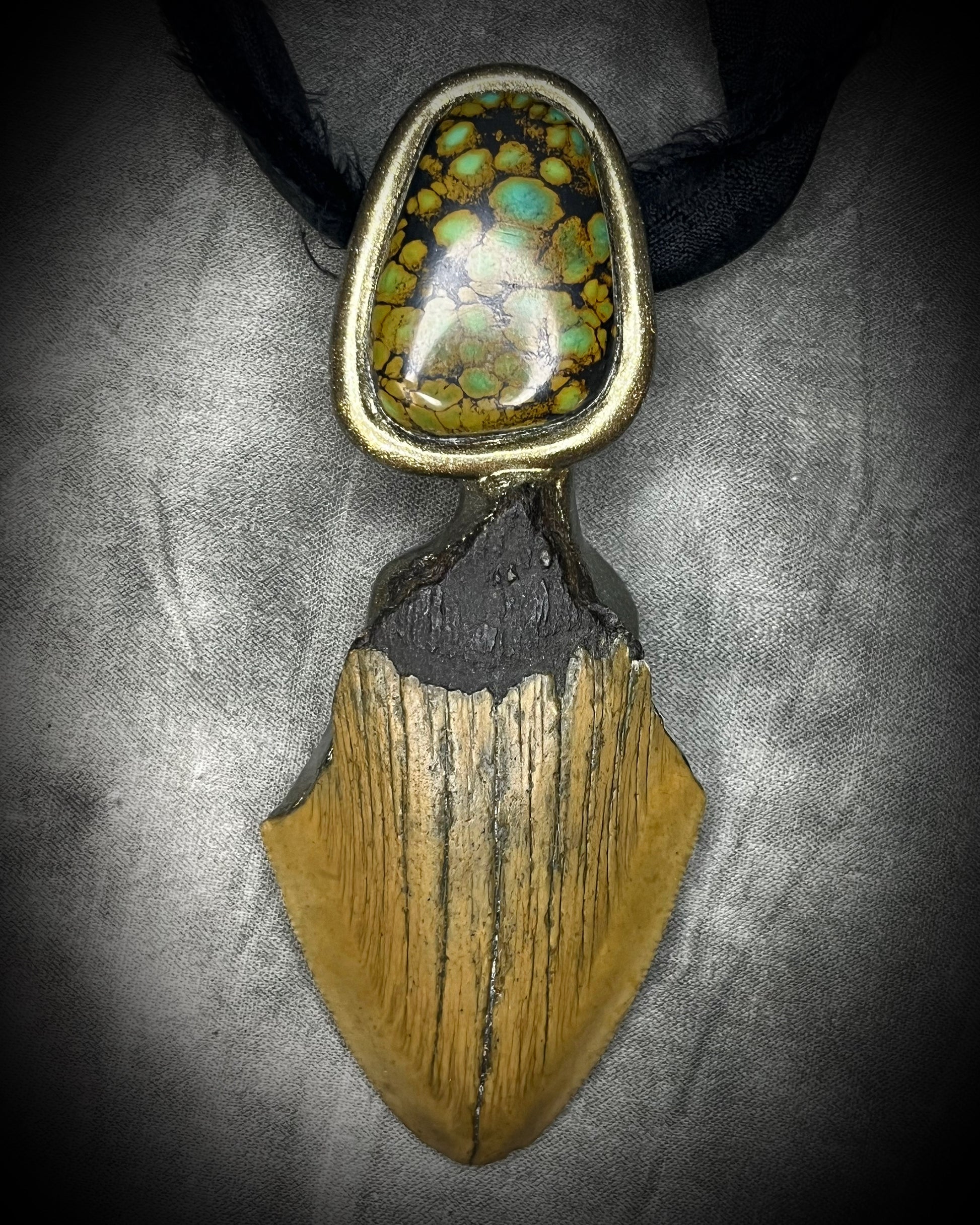Megalodon fossil tooth talisman with sculptural turquoise in blue, moss green and mustard yellow, gold finish and black recycled silk.