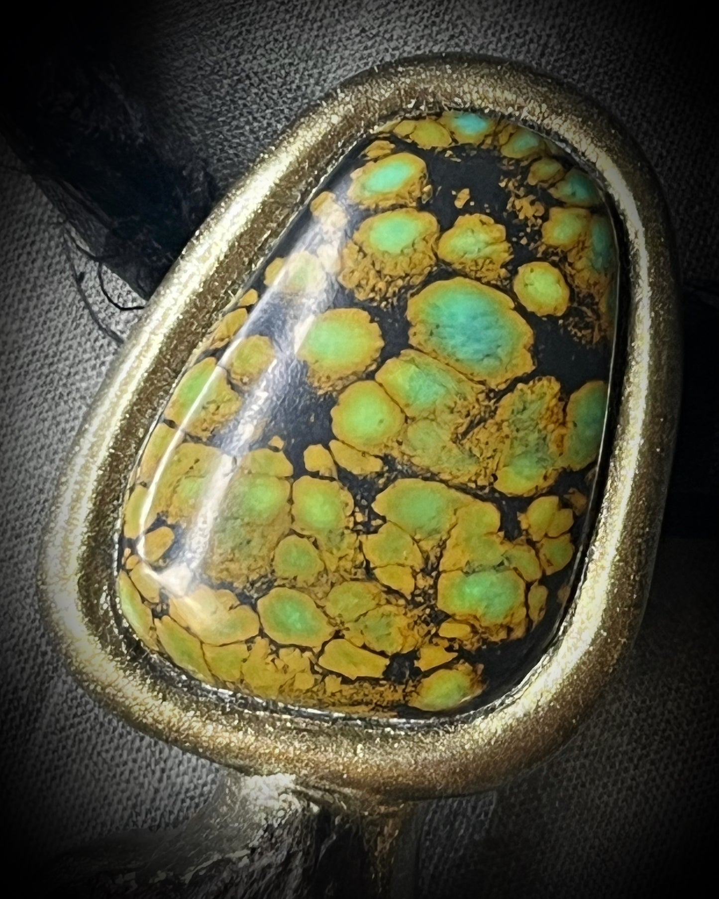 Megalodon fossil tooth talisman with sculptural turquoise in blue, moss green and mustard yellow, gold finish and black recycled silk.