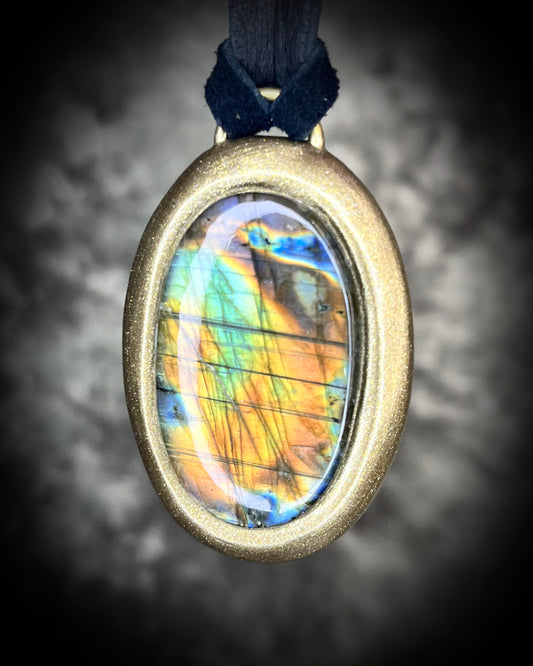 Mystical labradorite necklace on black leather cord, hand-sculpted artisan talisman with raw gemstone pendant, gothic crystal jewelry for spiritual style.