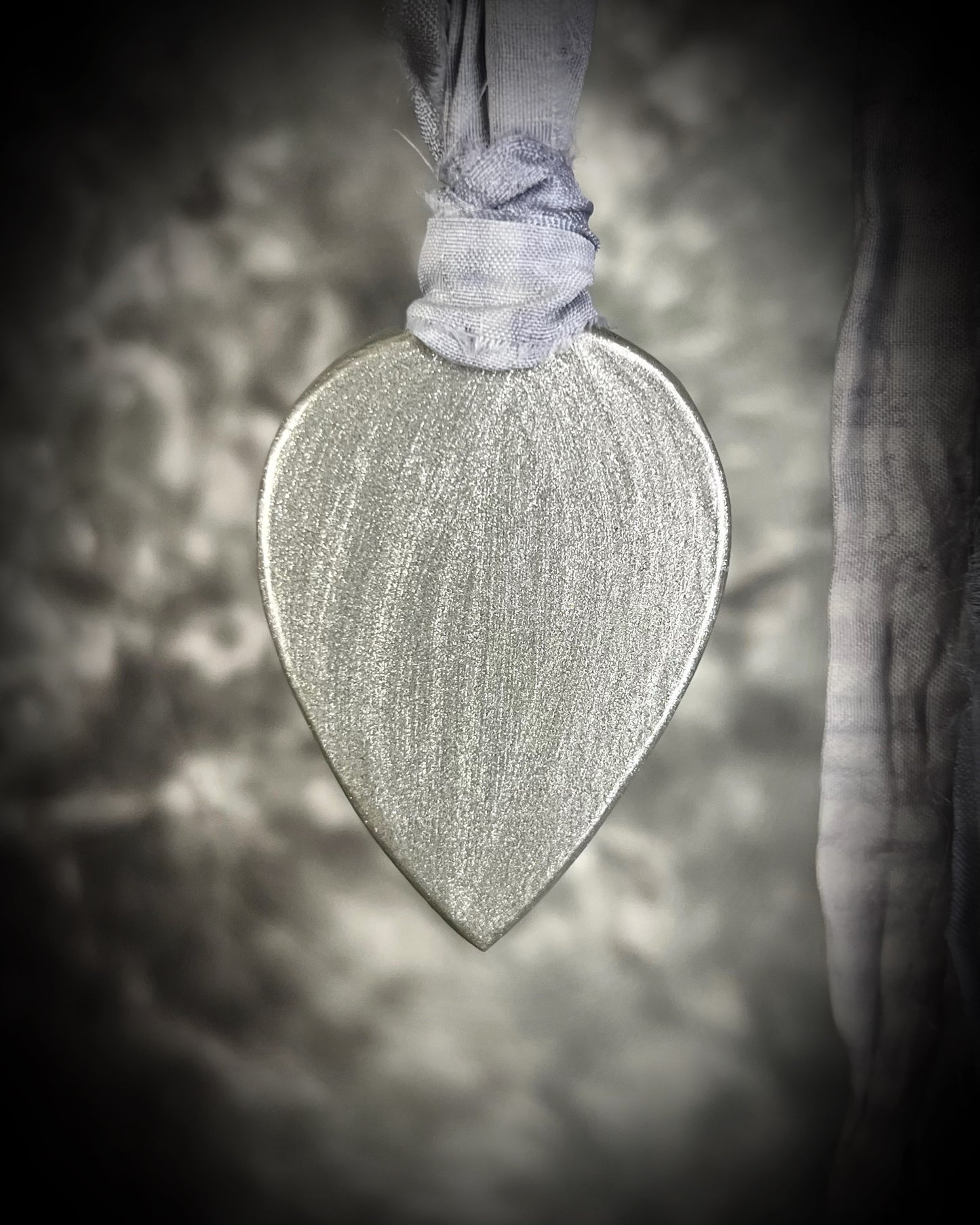 Mystical moonstone teardrop pendant in silver tone setting on recycled silk cord. Handmade crystal necklace for intuition, divine feminine energy, and spiritual connection. Unique gemstone jewelry for meditation, daily wear, or gifting.