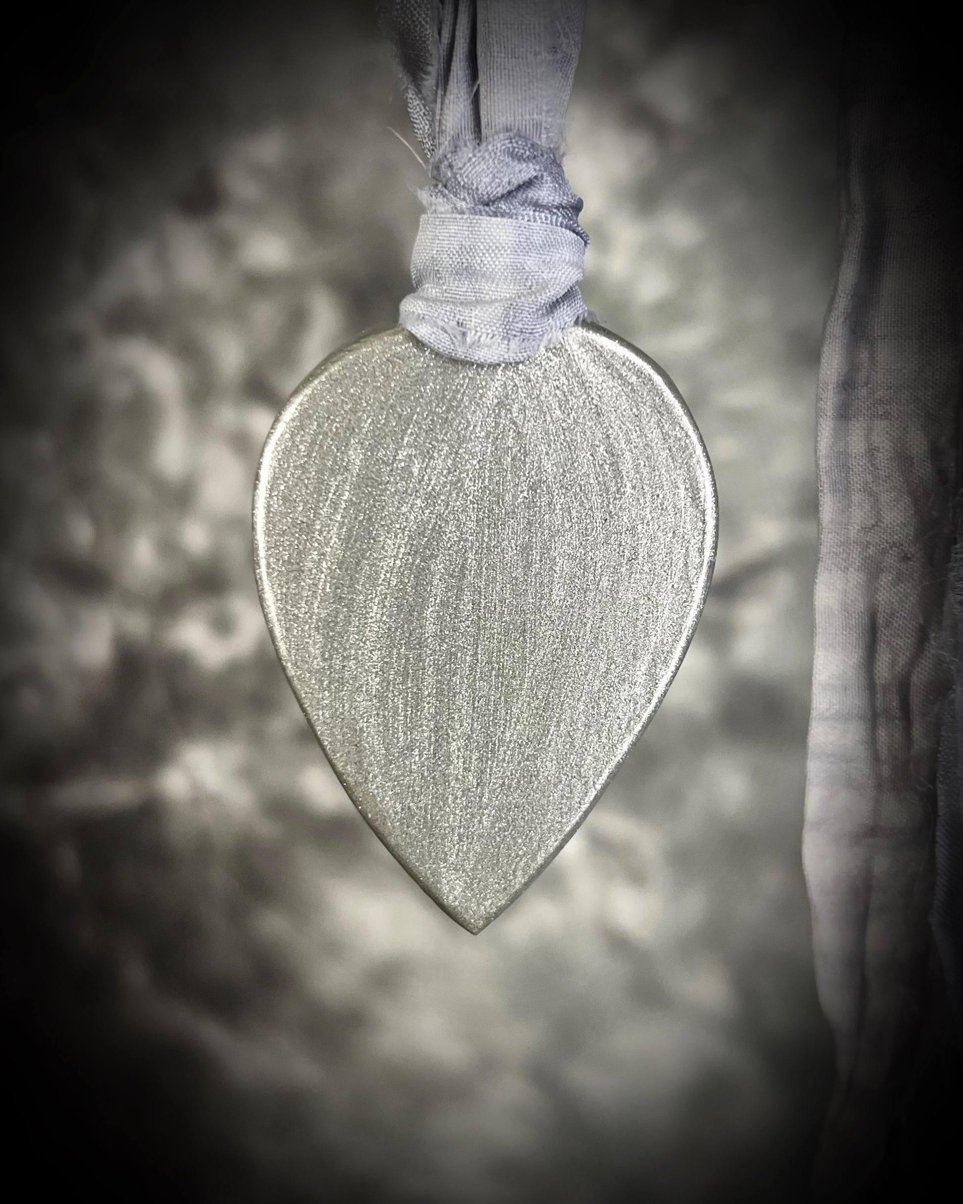 Mystical moonstone teardrop pendant in silver tone setting on recycled silk cord. Handmade crystal necklace for intuition, divine feminine energy, and spiritual connection. Unique gemstone jewelry for meditation, daily wear, or gifting.
