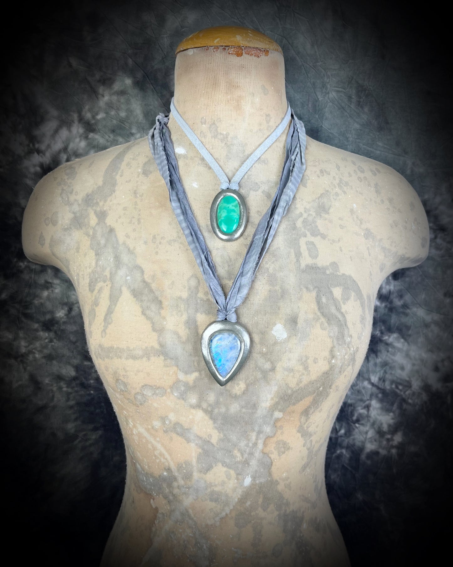 Mystical moonstone teardrop pendant in silver tone setting on recycled silk cord. Handmade crystal necklace for intuition, divine feminine energy, and spiritual connection. Unique gemstone jewelry for meditation, daily wear, or gifting.