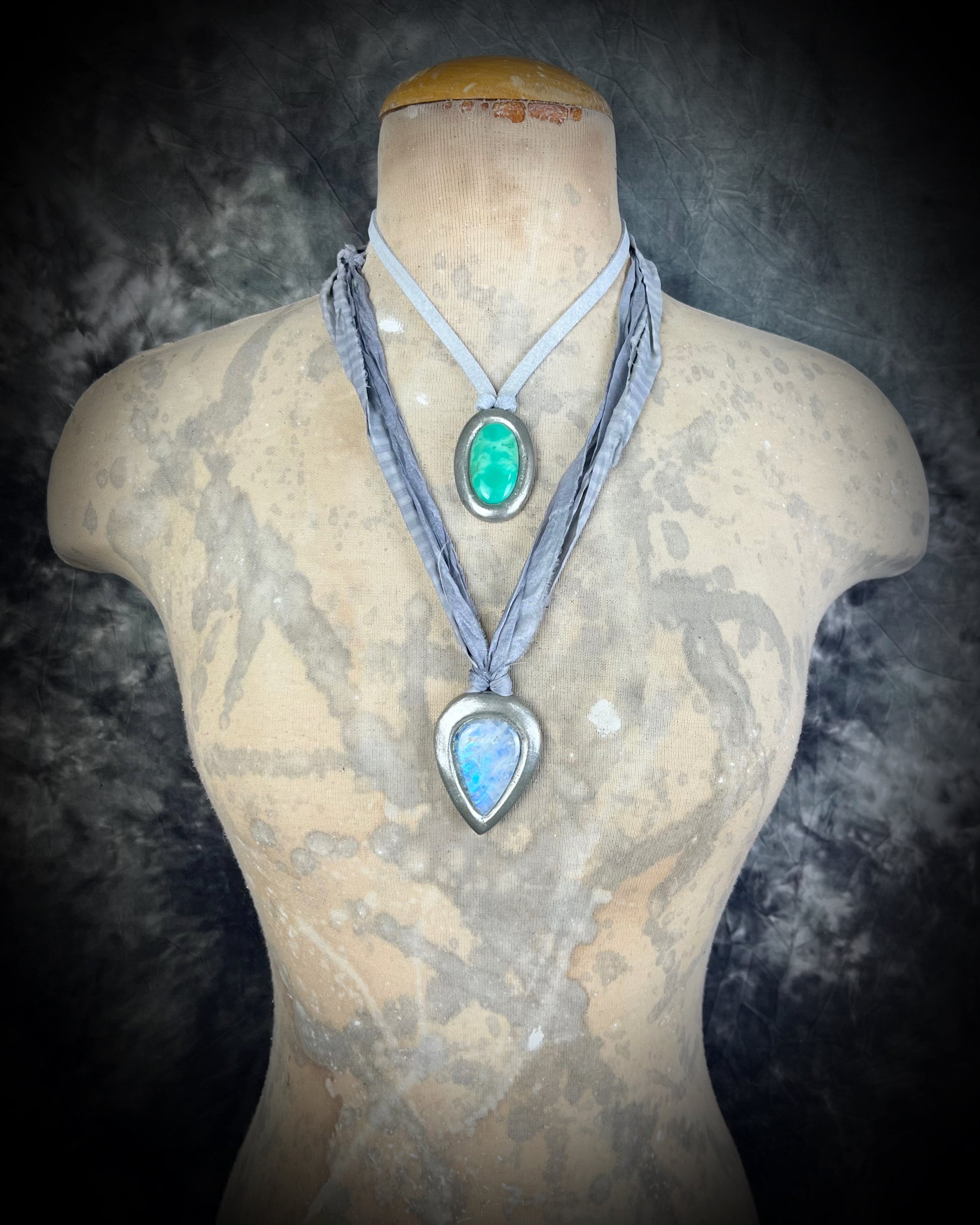 Mystical moonstone teardrop pendant in silver tone setting on recycled silk cord. Handmade crystal necklace for intuition, divine feminine energy, and spiritual connection. Unique gemstone jewelry for meditation, daily wear, or gifting.