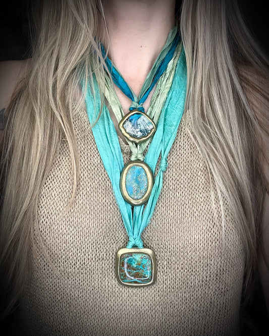 Ocean inspired beachy layering necklaces featuring turquoise gemstones and sea green and aqua recycled silk.