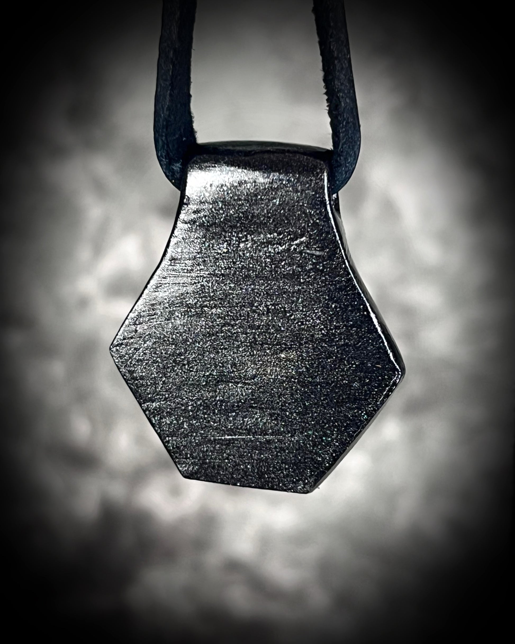 Opalescent quartz gemstone necklace with shimmering opal colors, bold gothic pendant on black leather, fantasy-inspired and witchy handmade jewelry.