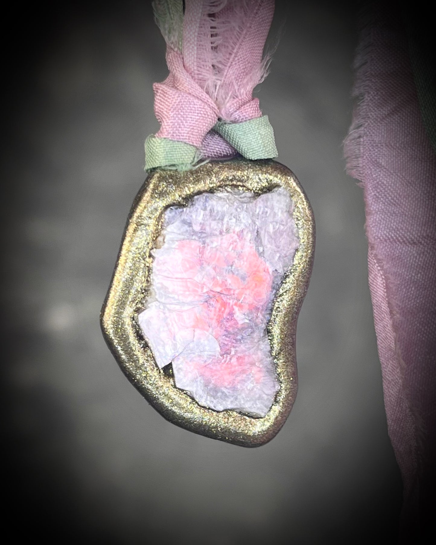 Organic lepidolite crystal talisman  pendant with sculpted gold finish and mint green and lilac recycled silk ties. Handmade by Become Spellbound.