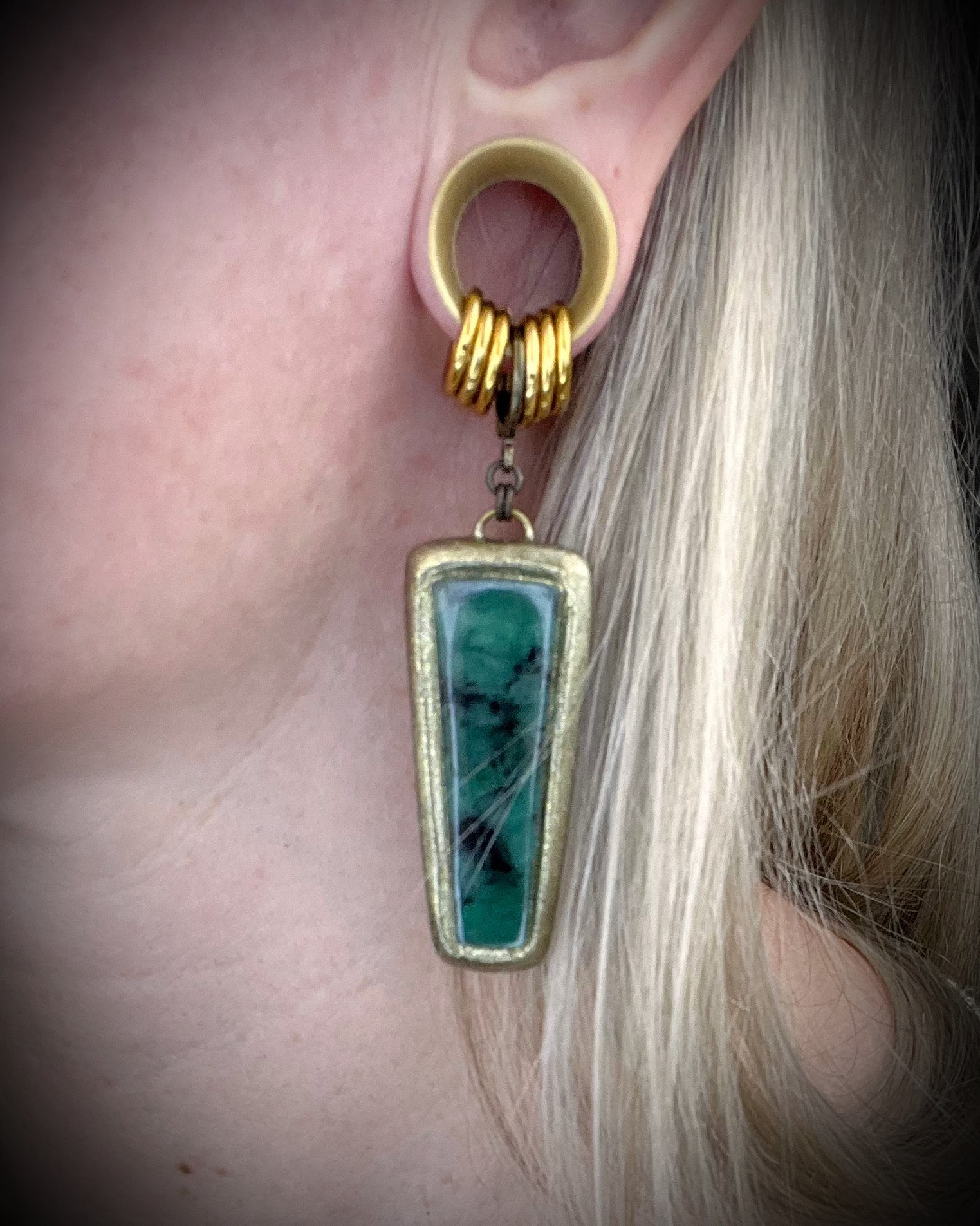 Oversized Emerald gemstone earrings in gold finish with hypoallergenic brass huggie hooks, green crystal statement jewelry handmade in Baltimore Maryland.