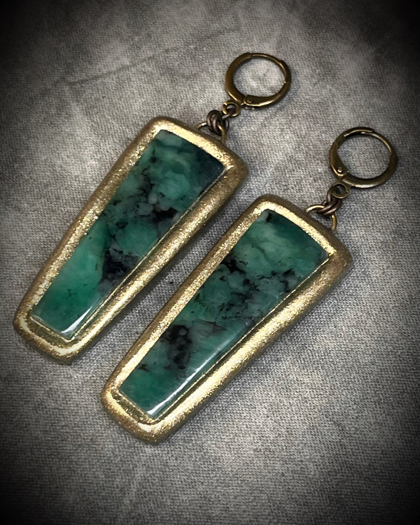 Oversized Emerald gemstone earrings in gold finish with hypoallergenic brass huggie hooks, green crystal statement jewelry handmade in Baltimore Maryland.