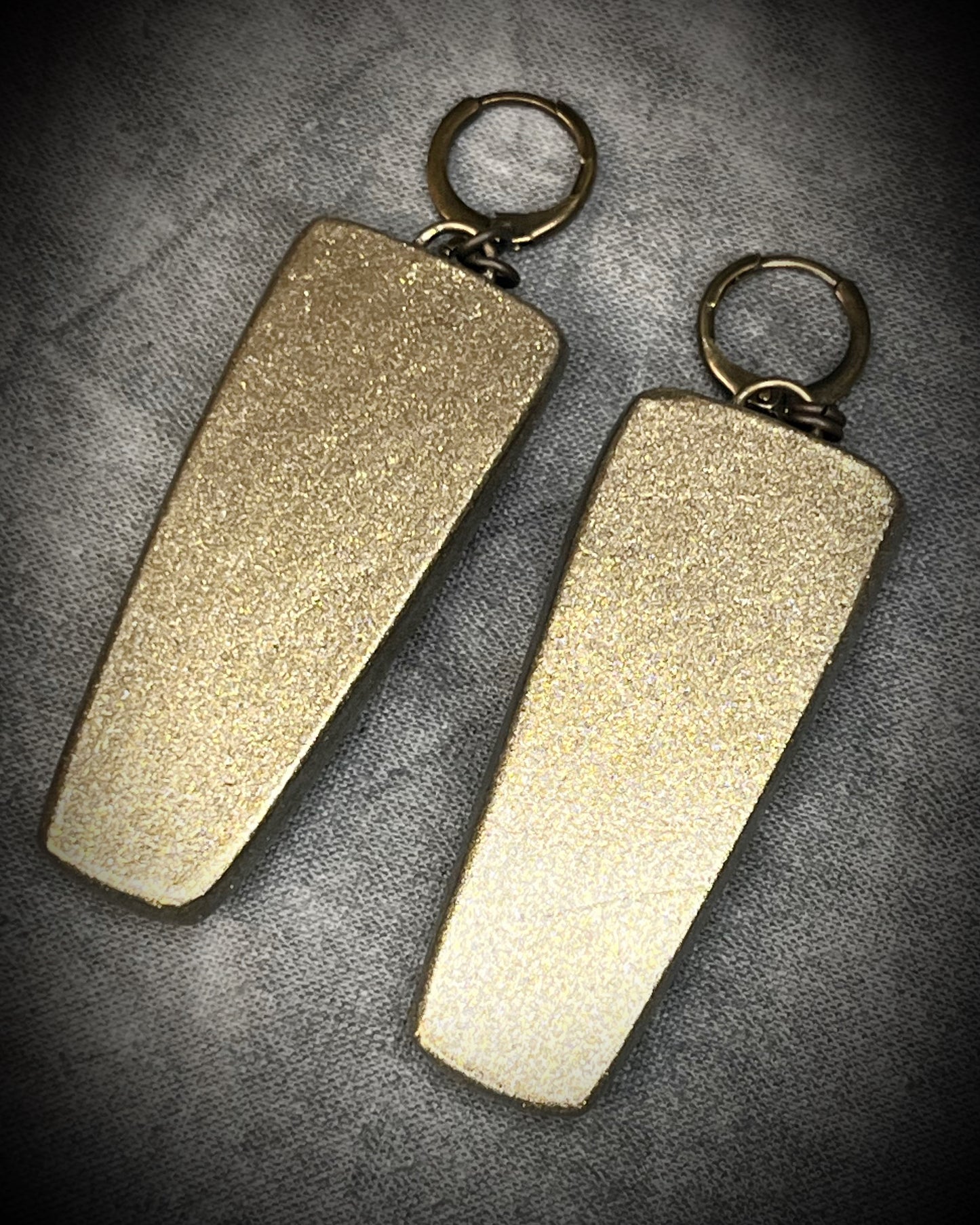 Oversized Emerald gemstone earrings in gold finish with hypoallergenic brass huggie hooks, green crystal statement jewelry handmade in Baltimore Maryland. back view. 