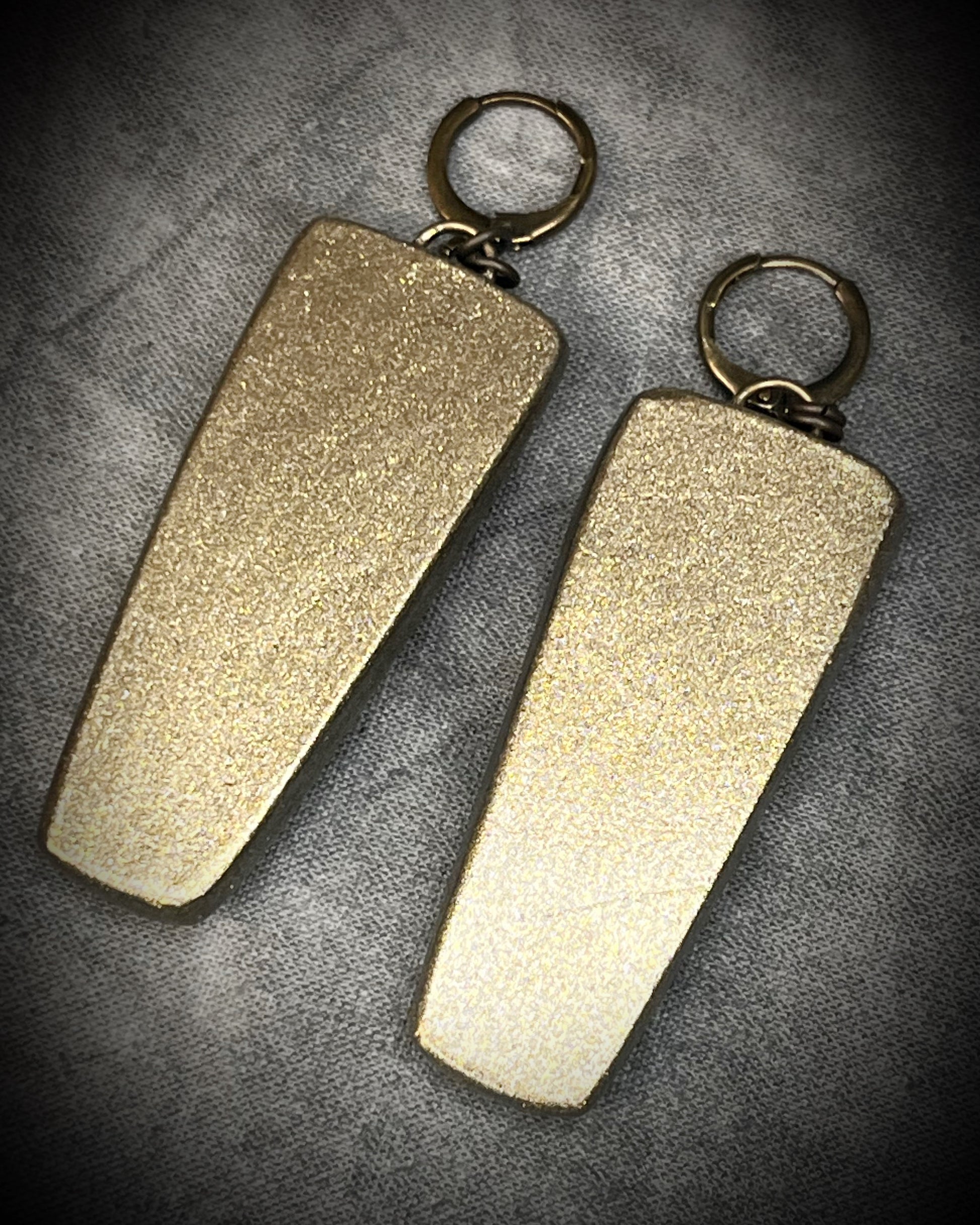 Oversized Emerald gemstone earrings in gold finish with hypoallergenic brass huggie hooks, green crystal statement jewelry handmade in Baltimore Maryland. back view. 