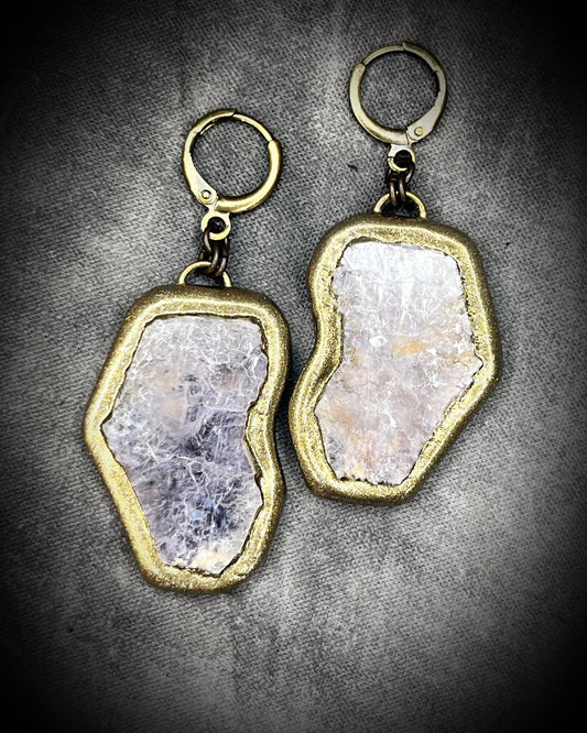 Pair of gold and lepidolite crystal anti-anxiety earrings with natural stone design on a gray background. Gold dangle earrings gift for her! 