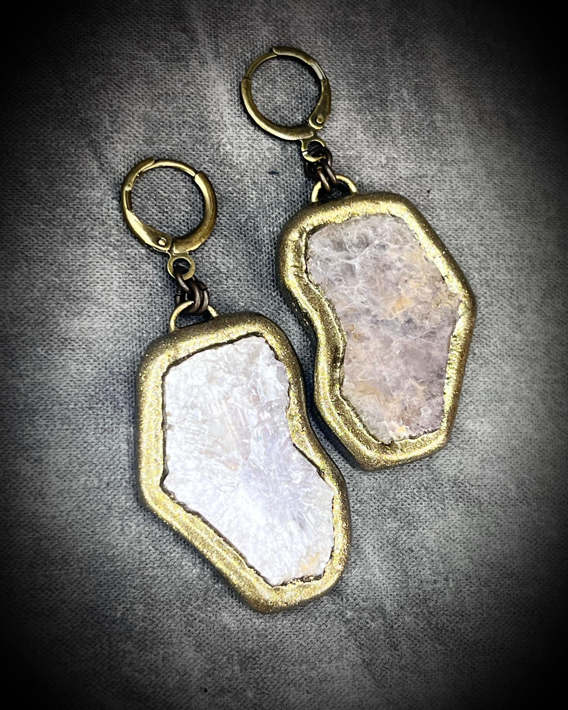 Pair of gold and lepidolite crystal anti-anxiety earrings with natural stone design on a gray background. Holiday handmade jewelry stocking stuffer gift for her!