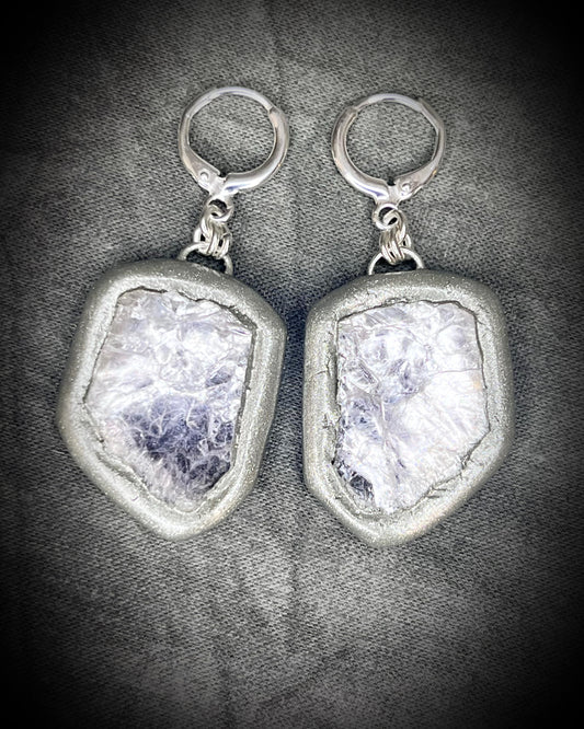 Pair of silver dangle earrings with raw lepidolite crystal gemstones on a dark background. Chunky silver jewelry holiday gift for her. 