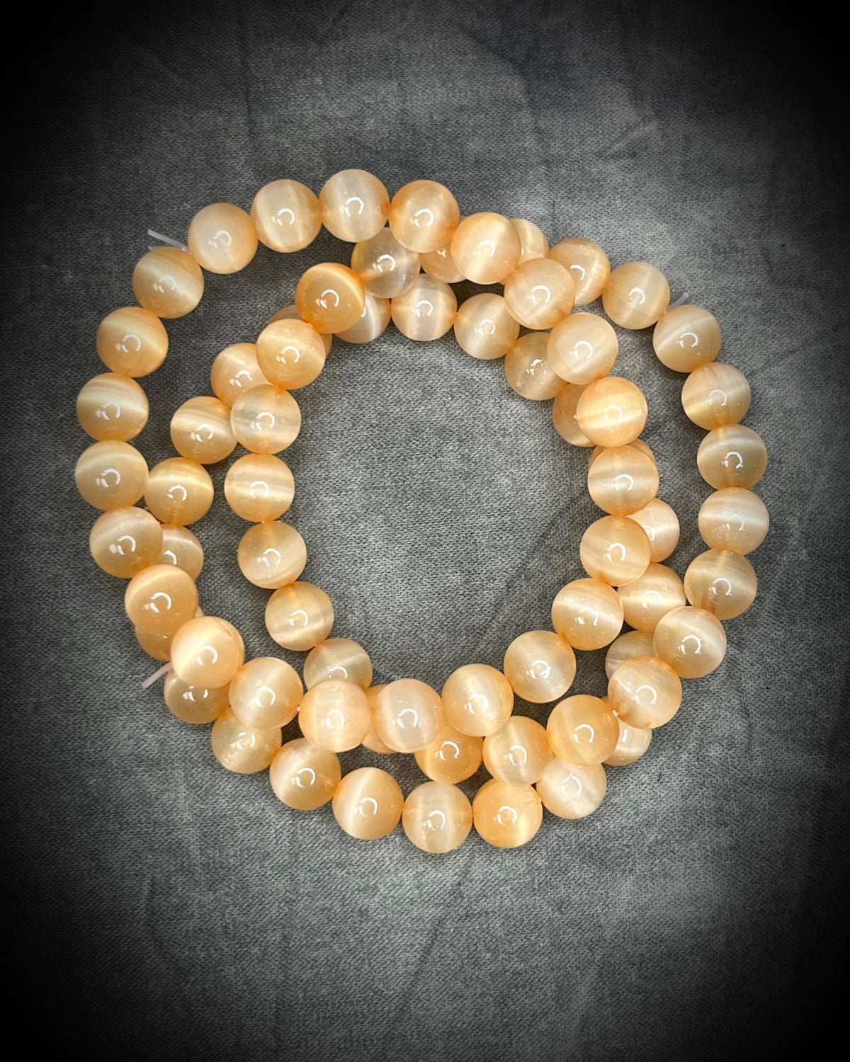 Peach colored Selenite crystal healing beaded bracelets for protection, grounding, emf shielding and gemstone magic!  Crystal stacking bracelets for gifting and everyday magic.