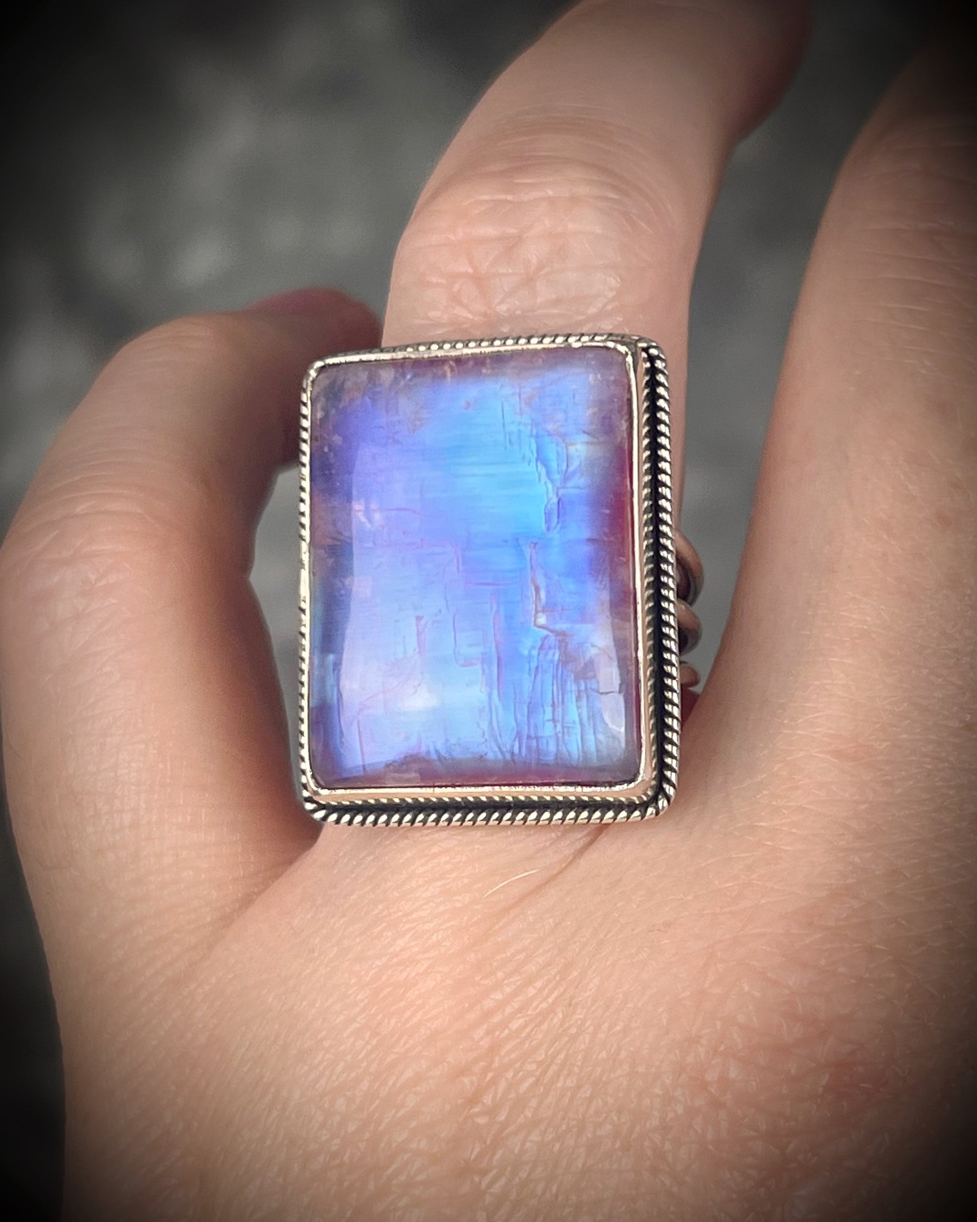 Pink moonstone sterling silver ring with luminous magenta tones and iridescent flash, celestial gemstone jewelry
