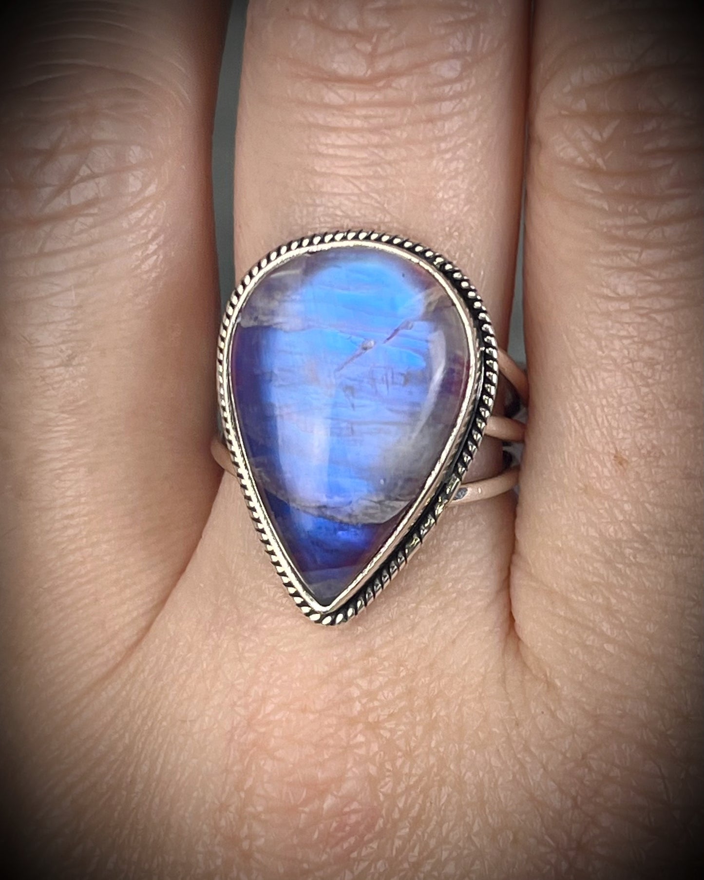 Pink moonstone sterling silver ring with luminous magenta tones and iridescent flash, celestial gemstone jewelry, teardrop shaped ring. 