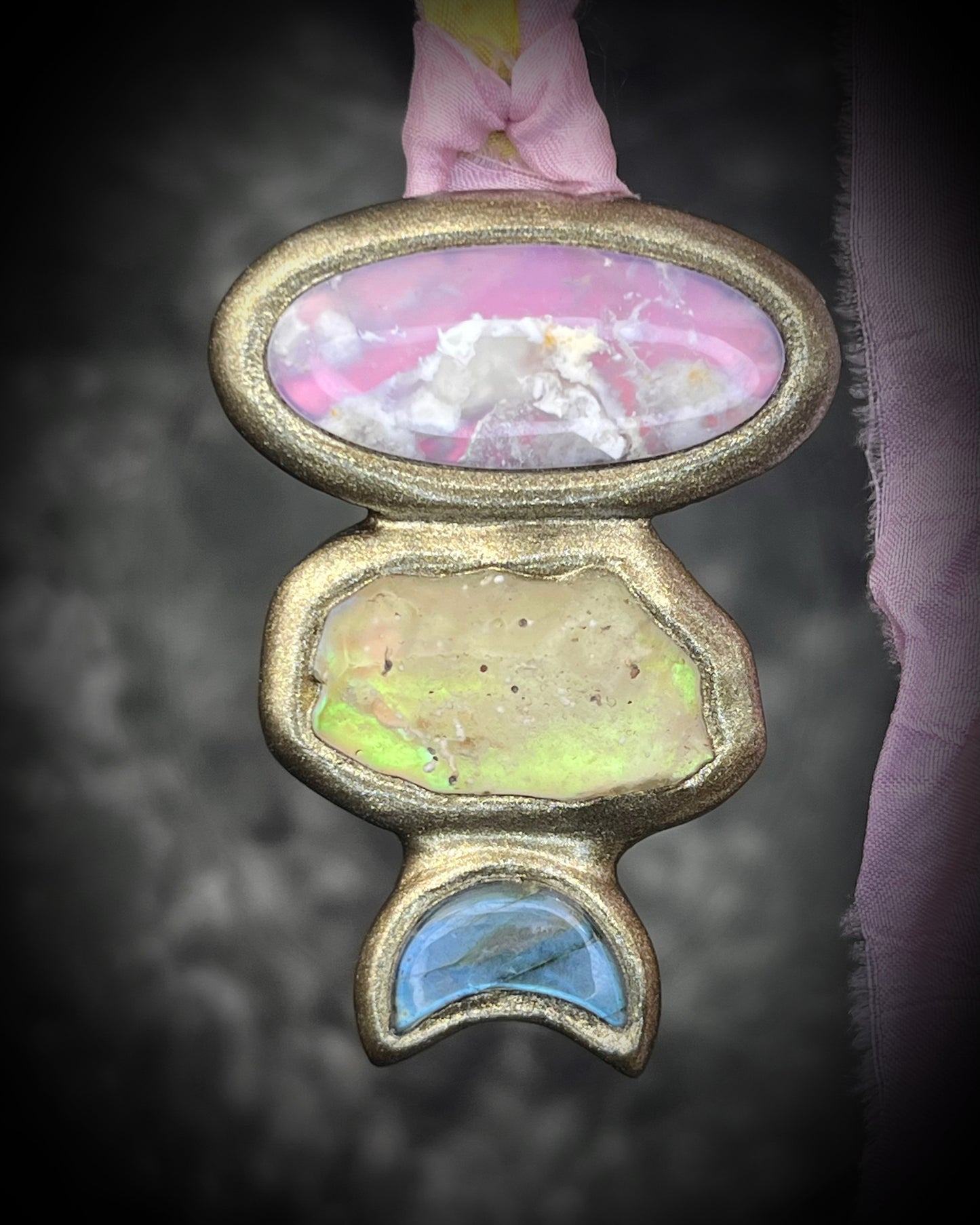 Pink plume agate talisman with Libyan Desert Glass and labradorite moon on pink and yellow recycled silk ties, hand sculpted by Become Spellbound, Baltimore Magazine Best of Baltimore 2026 Jewelry winner.