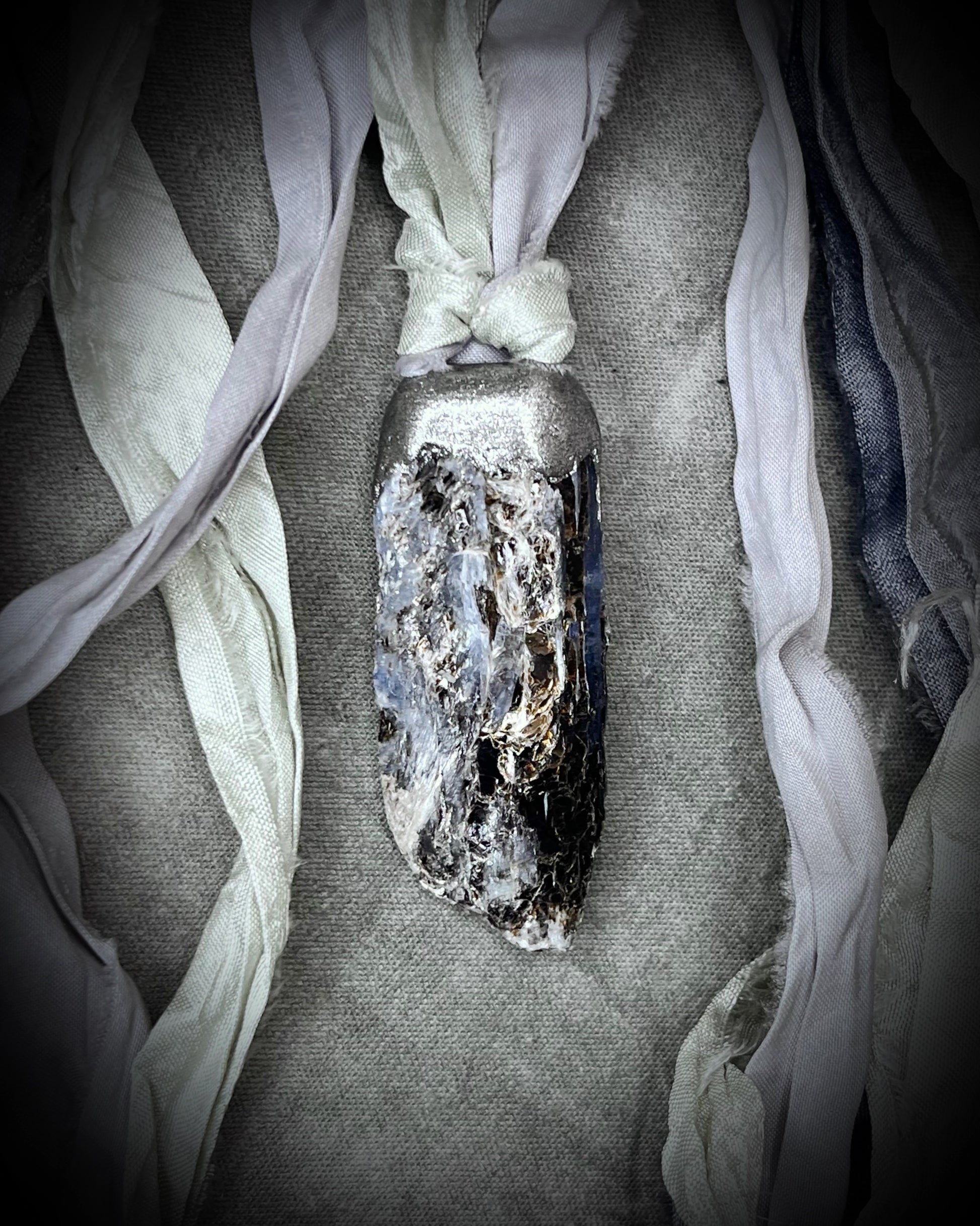 Ocean Blue Kyanite crystal healing throat chakra pendant on recycled silk for speaking your truth. Best travel jewelry for summer, sustainable festival jewelry or wedding necklace.